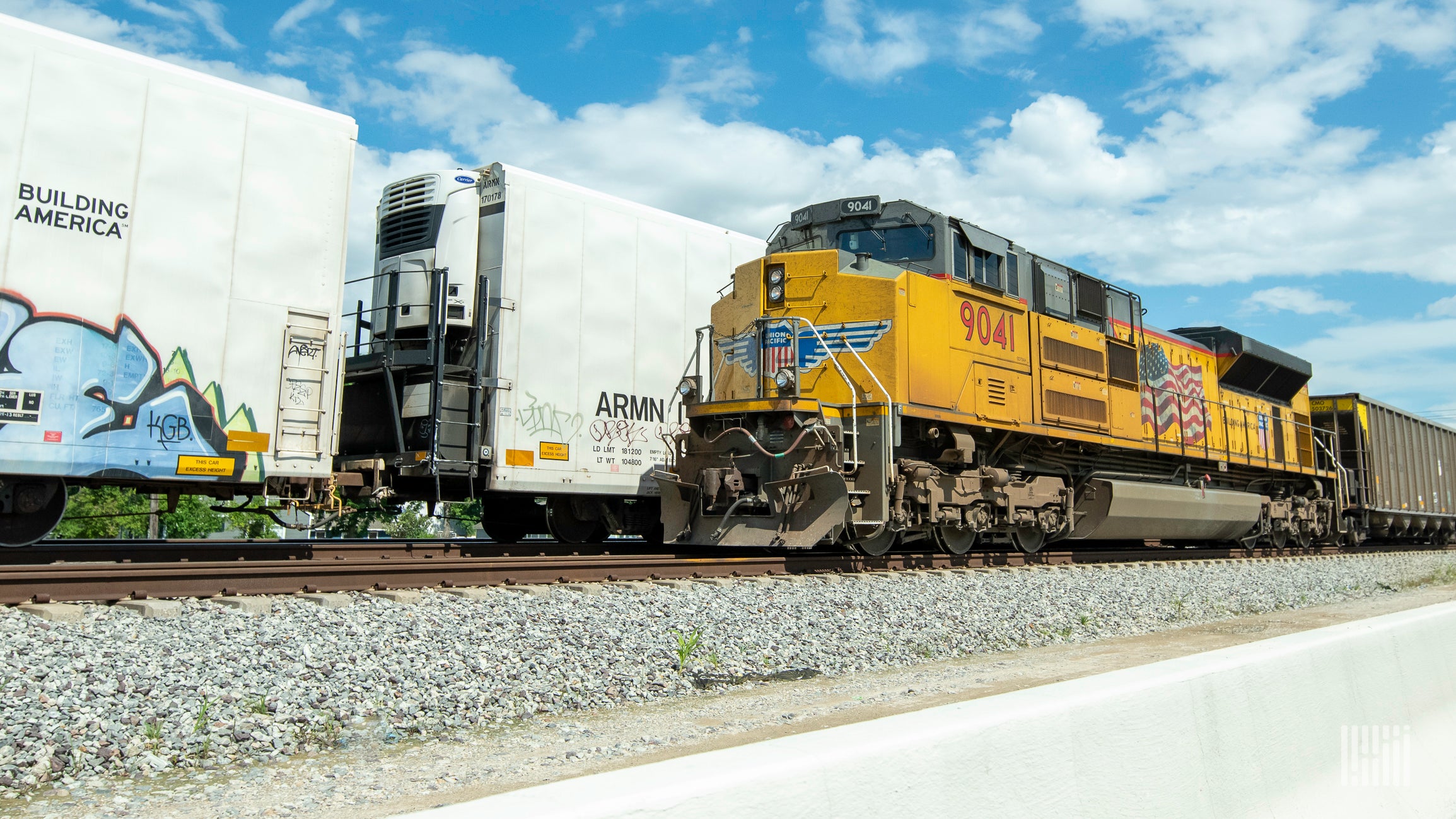 A photograph of a Union Pacific train on a train track.