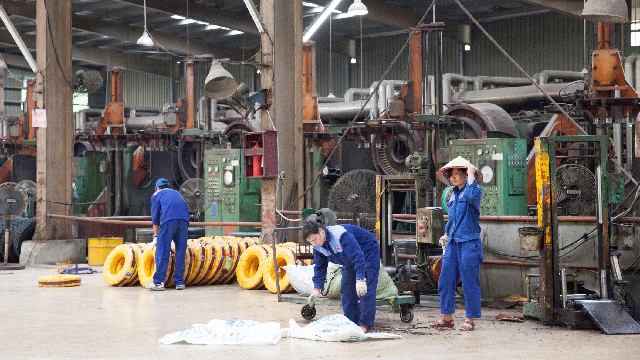 Workers in a rubber factory.