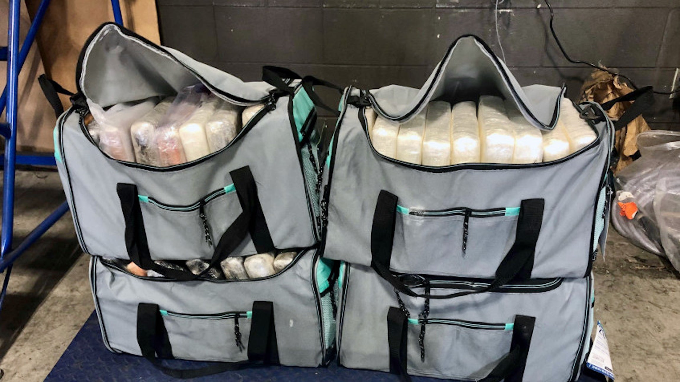 Four duffle bags filled with cocaine seized from a truck at the Canadian border.