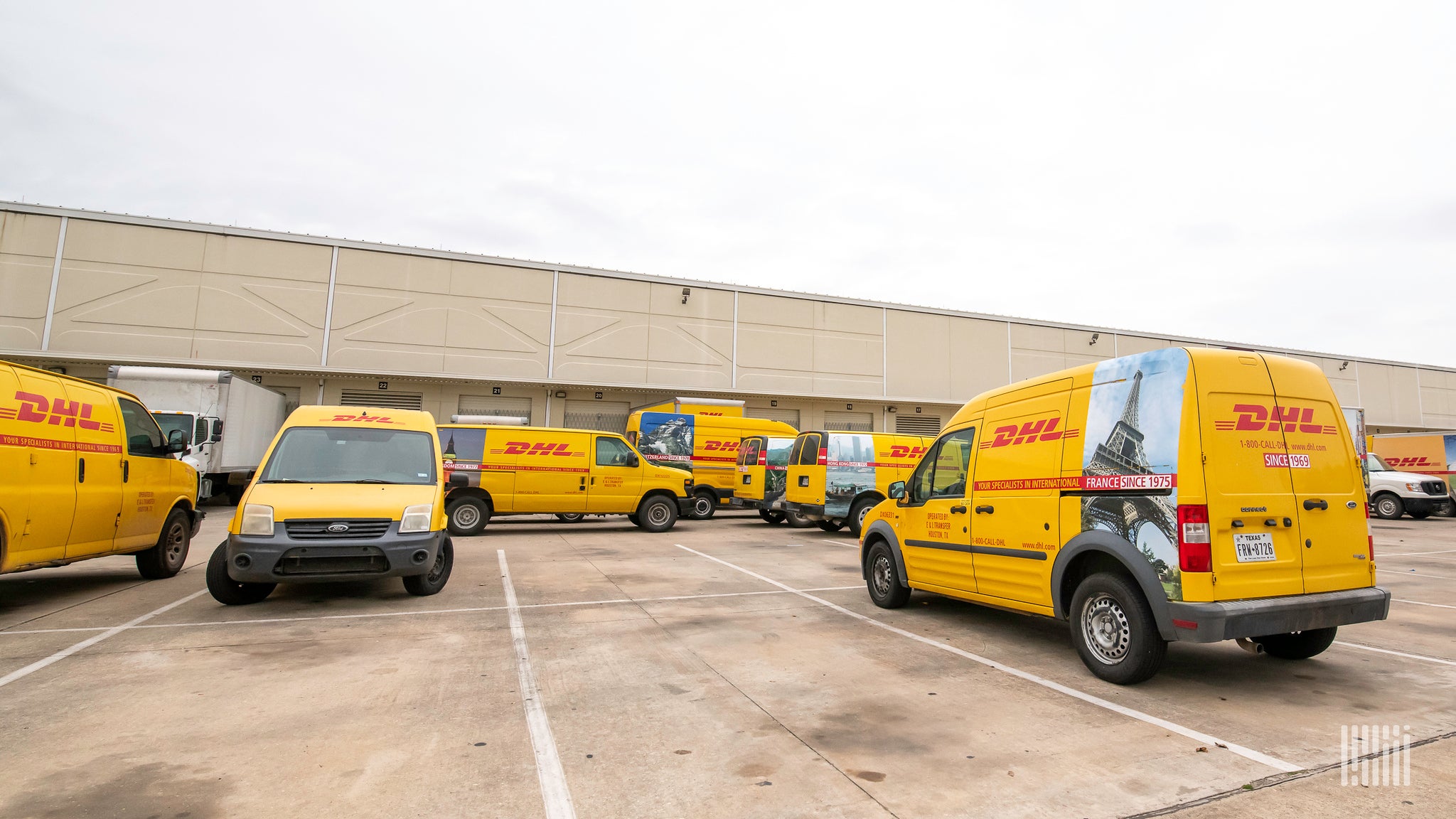 Parcel trucks outside a DHL Express facility in the U.S.