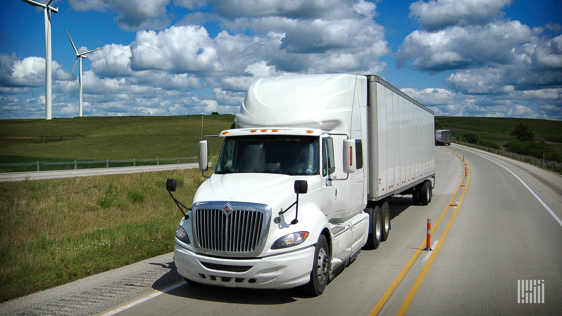 A white International ProStar truck viewed from the front as it travels on a highway to illustrate an article about the leak of data stolen from its manufacturer, Navistar.