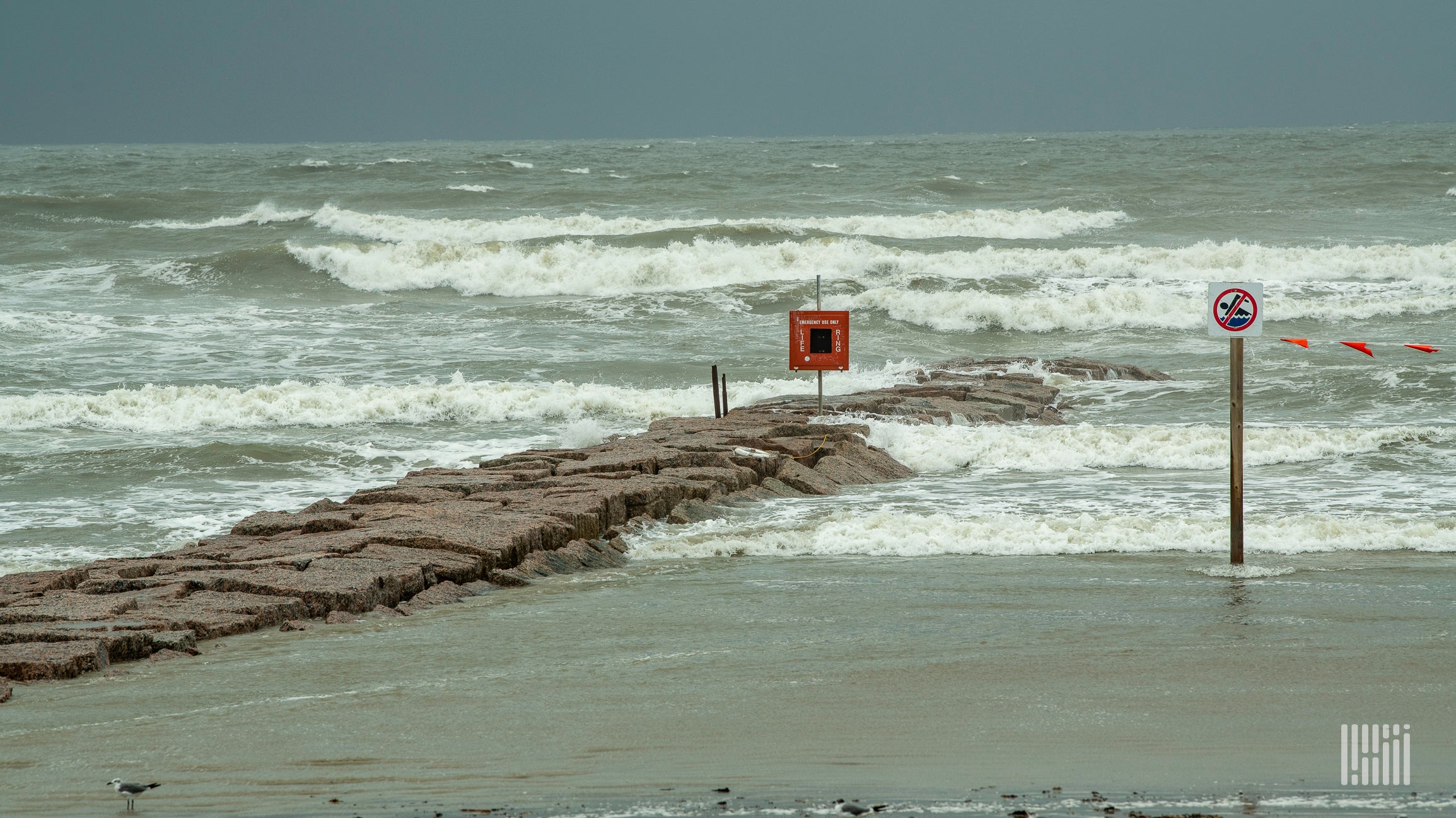 A photograph of a beach right before a hurricane.