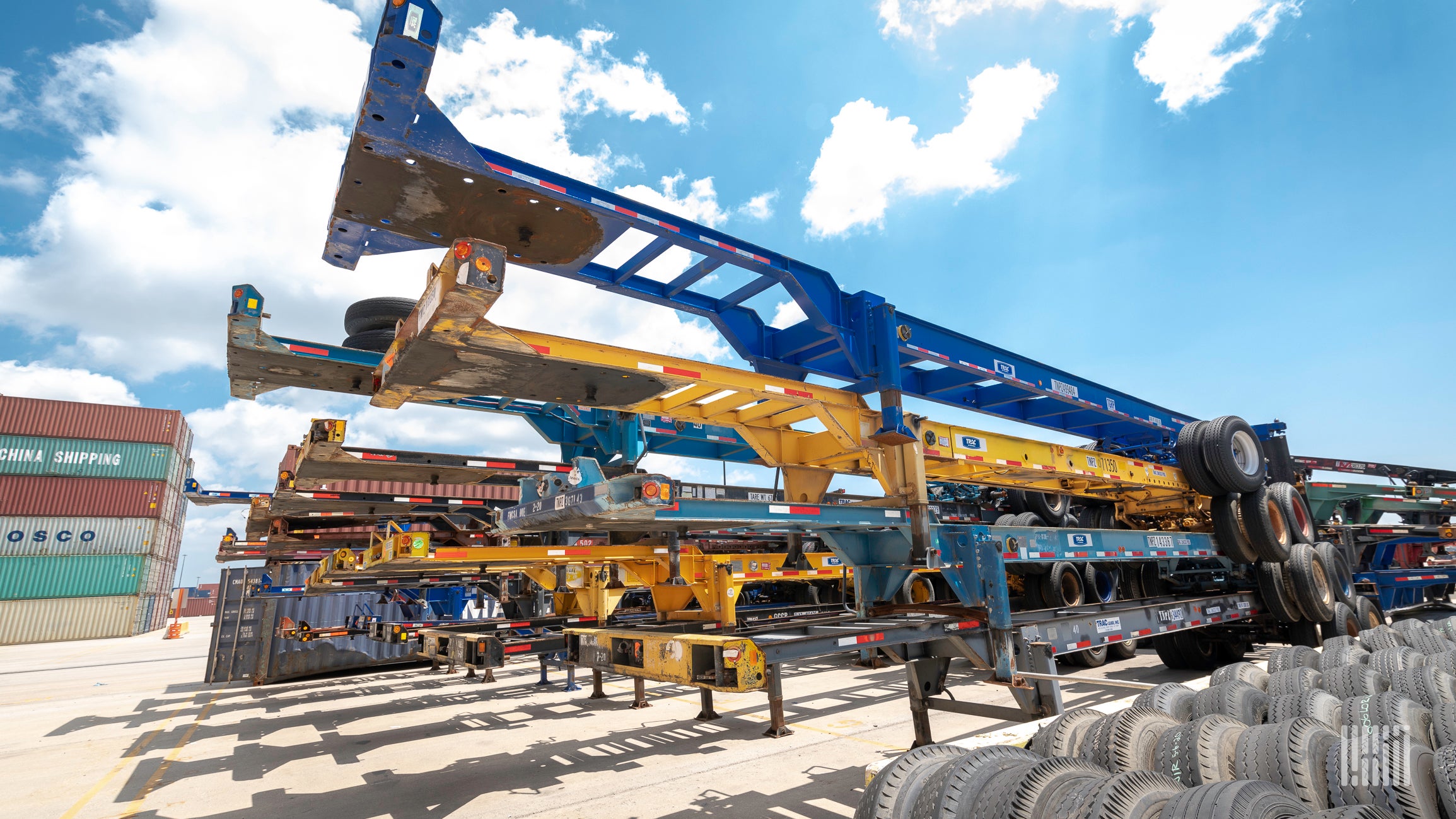 A photograph of chassis at a rail yard.