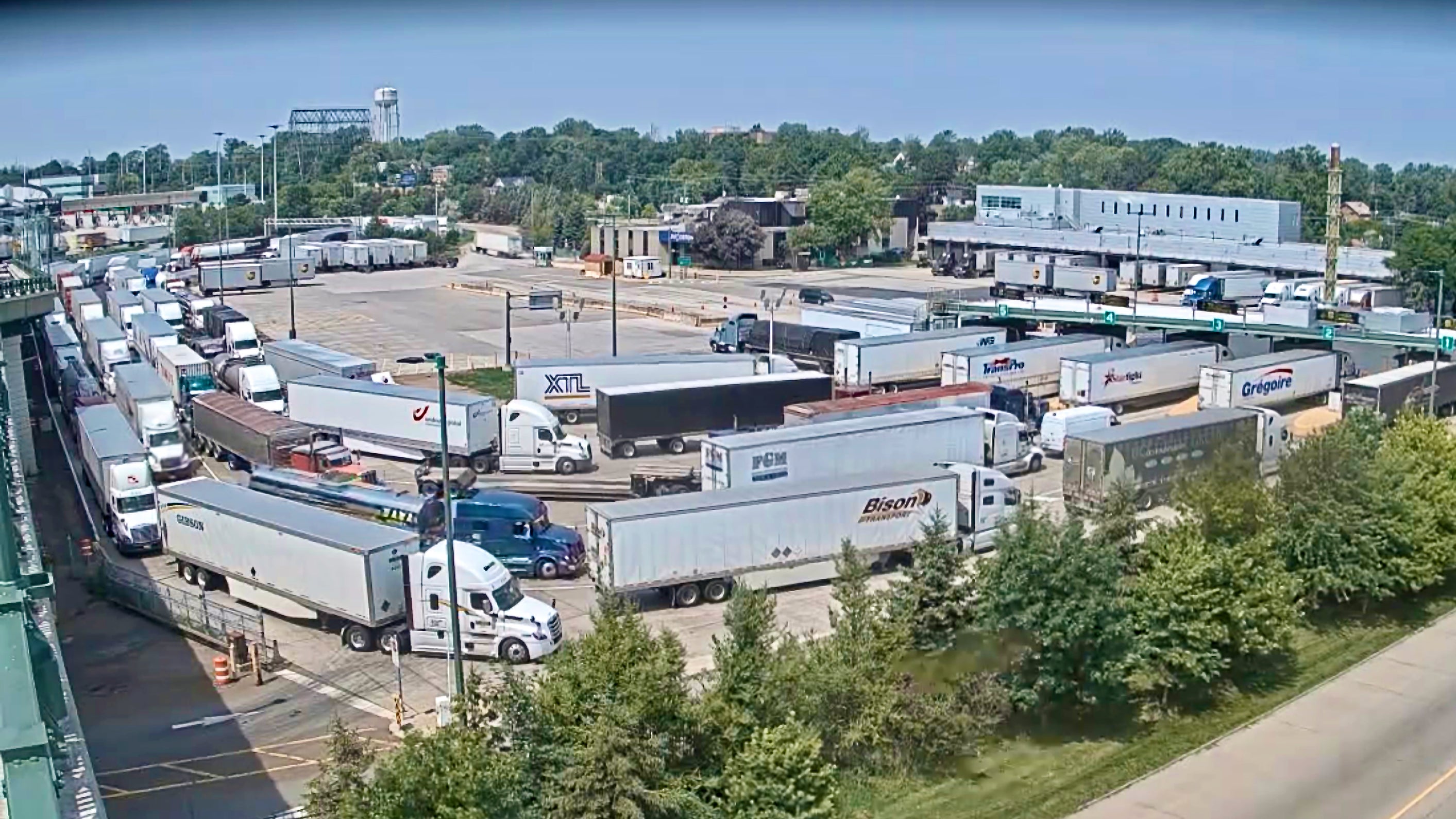 Trucks line up to enter Canada via the Peace Bridge port of entry on Friday afternoon.