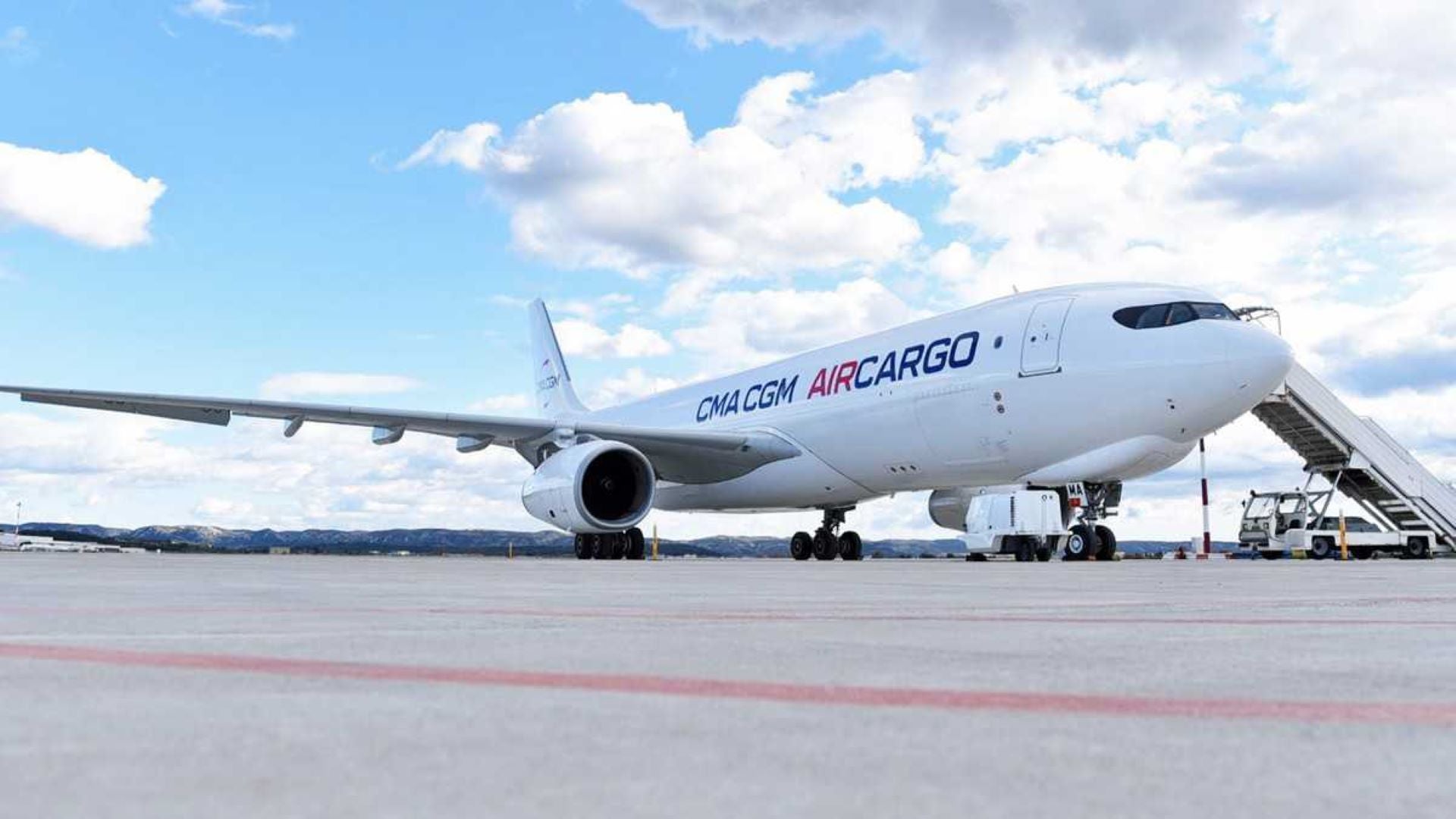 A white cargo jet with CMA CGM as logo.