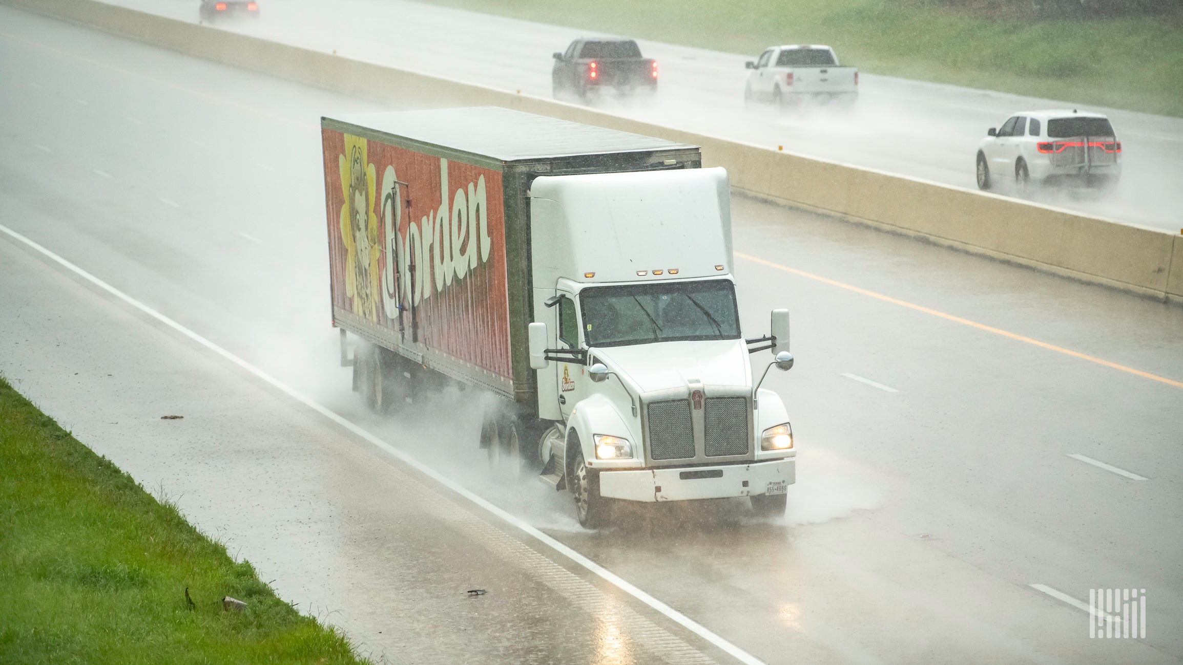 Tractor-trailer in heavy rainfall.