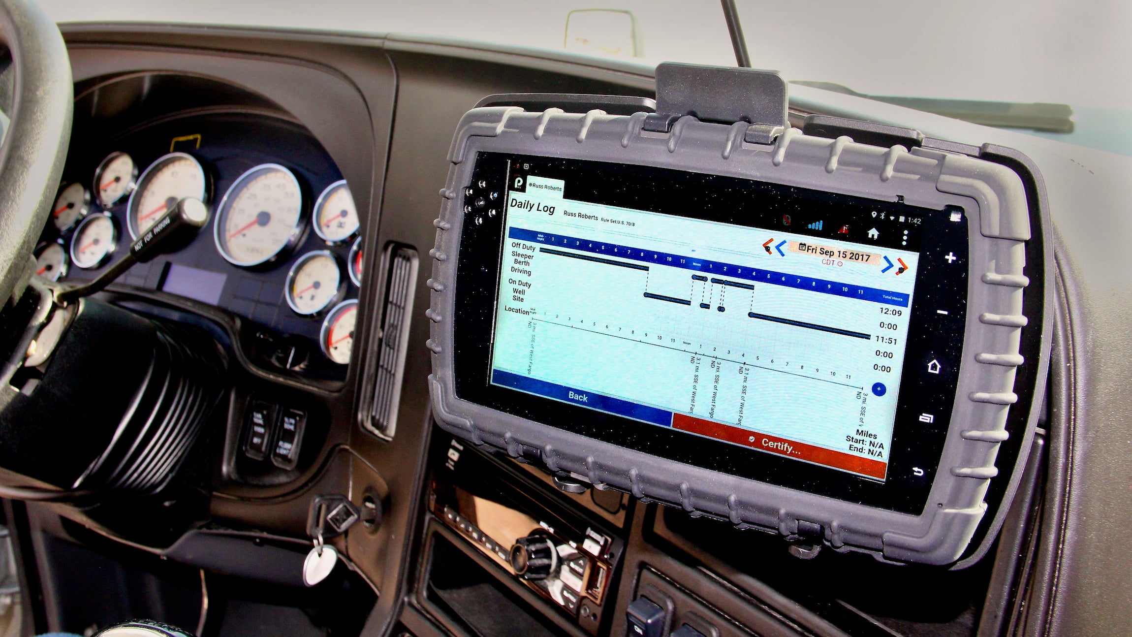 The screen of a Cab-Mate One ELD mounted inside a truck with its screen turned on. The device was recently certified in Canada.