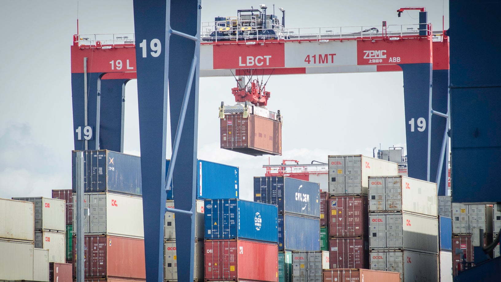 Rail-mounted gantry cranes cull container stacks at the Port of Long Beach.