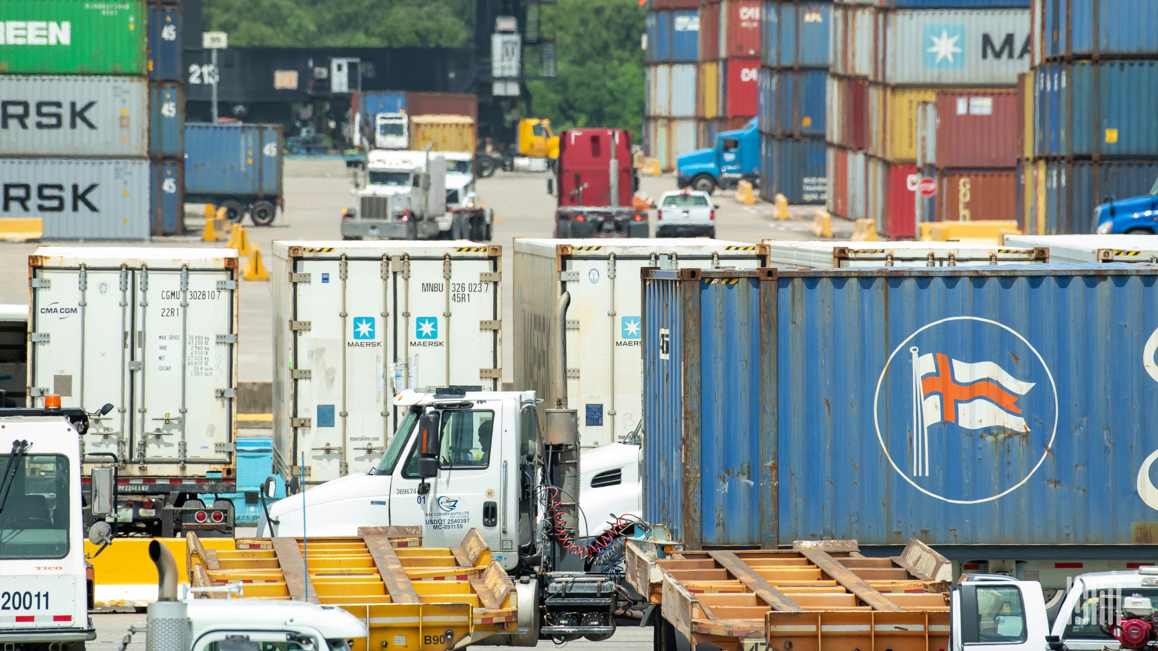 A photograph of containers at a terminal.