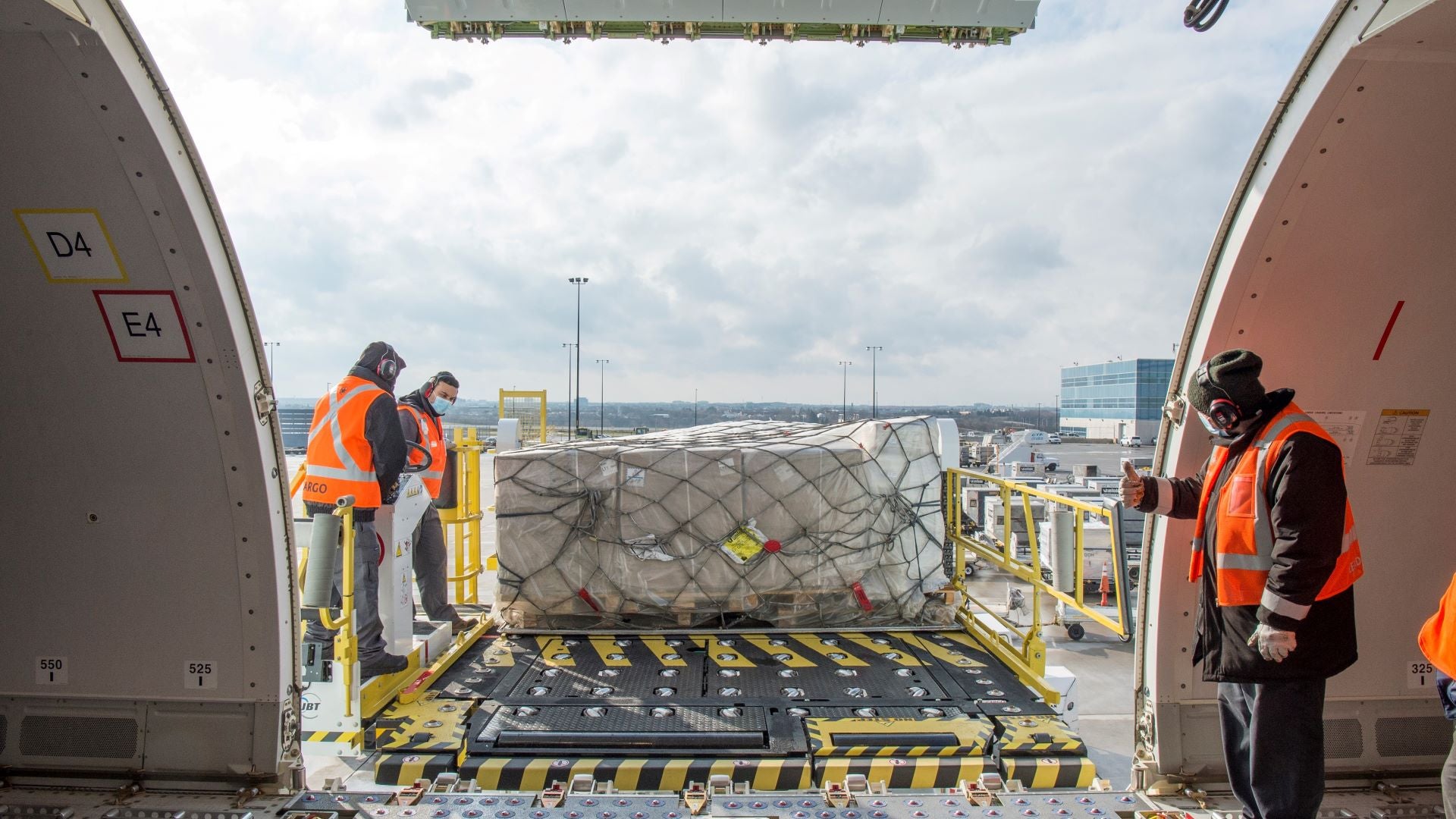 A cargo container ready to be slid through the door of a cargo jet.