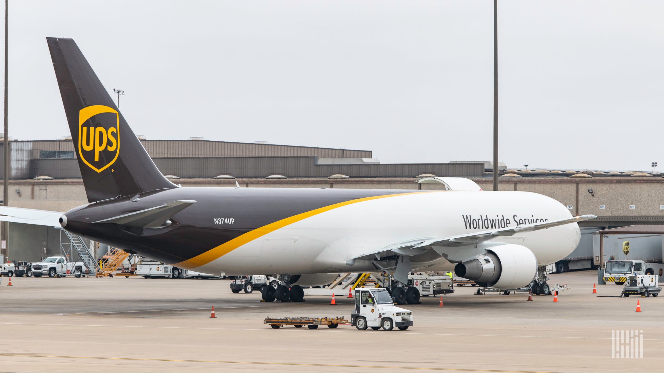 A brown-white UPS plane on the tarmac.