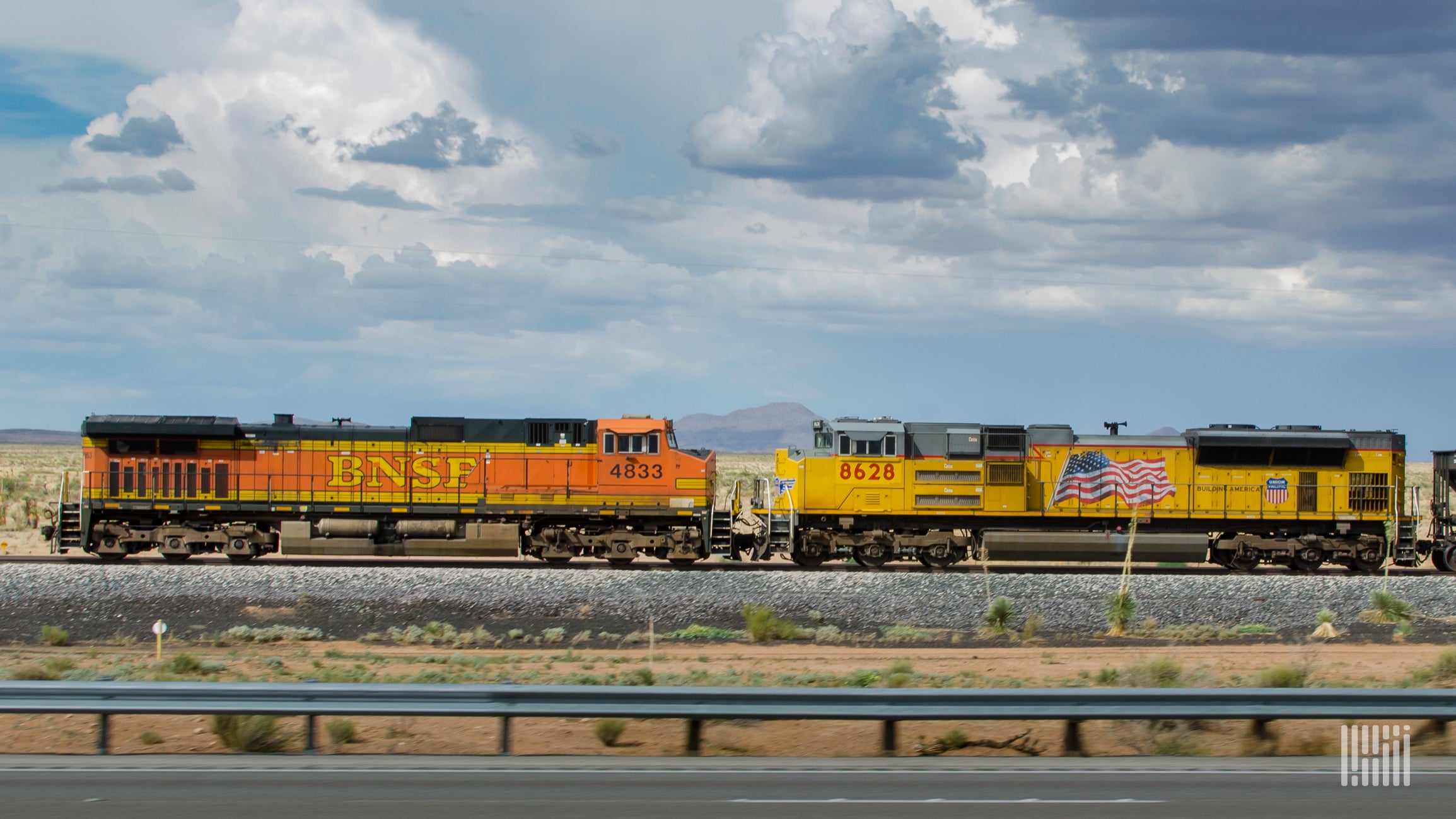 A photograph of a BNSF locomotive and a Union Pacific locomotive.