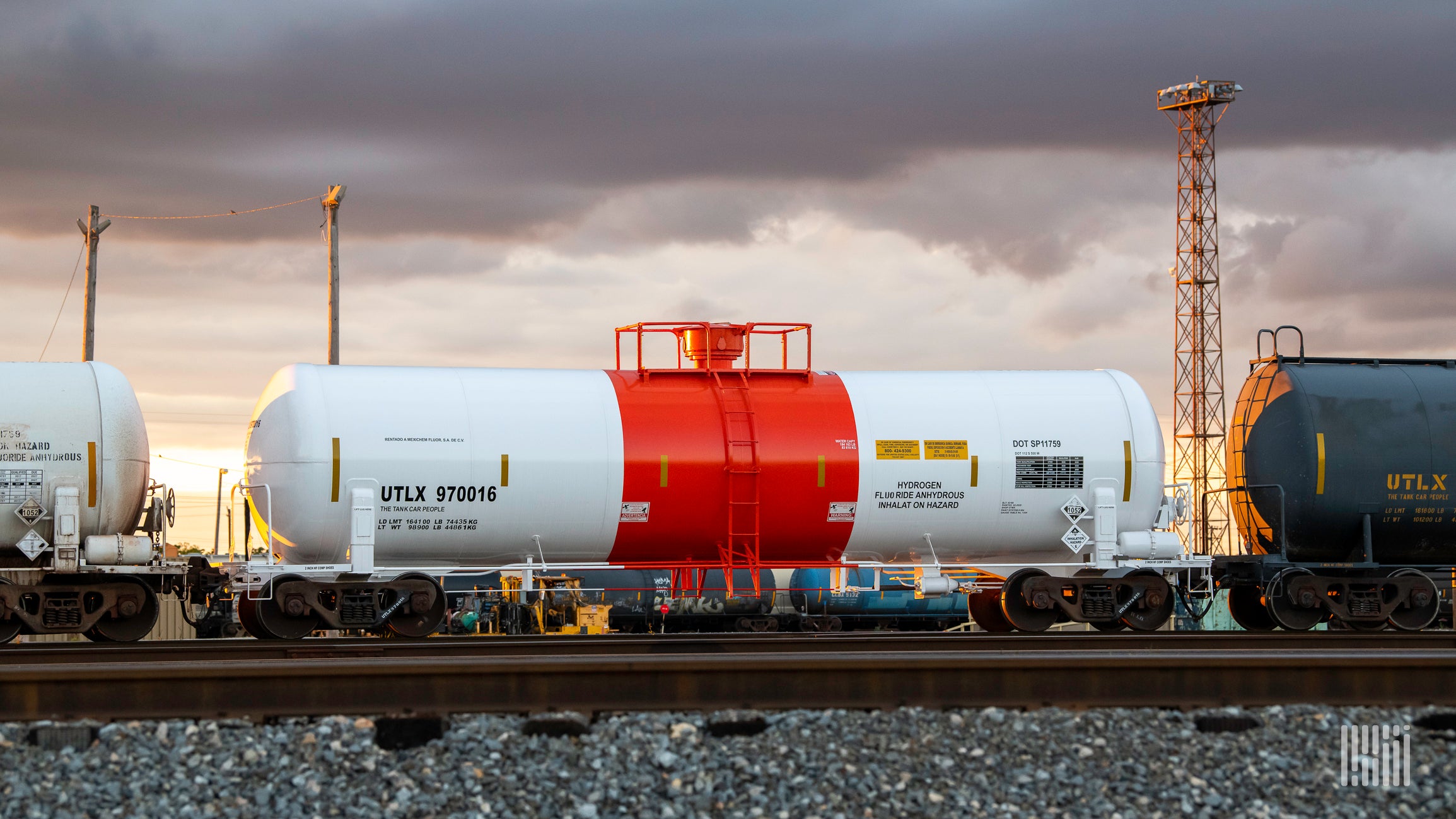 Chemical rail cars sit on a track to illustrate an article about new cybersecurity requirements in the freight rail sector.