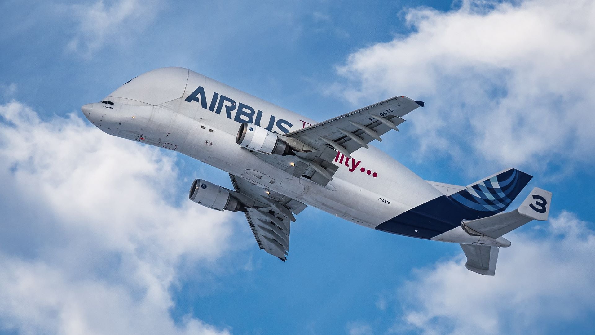 Funky Airbus Beluga cargo jet soars into the air, view from below