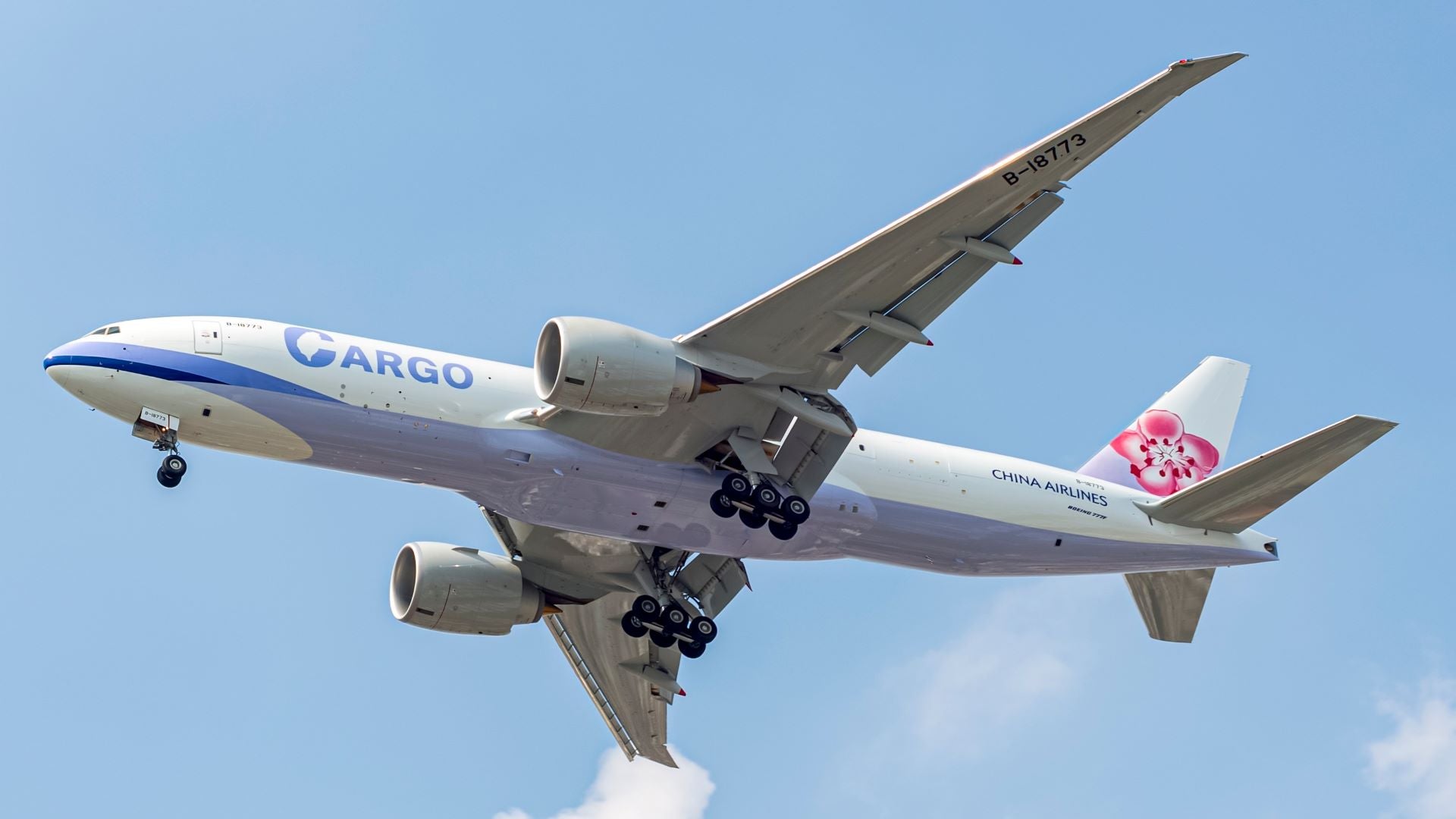 Underneath view of a China Airlines cargo jet flying overhead.