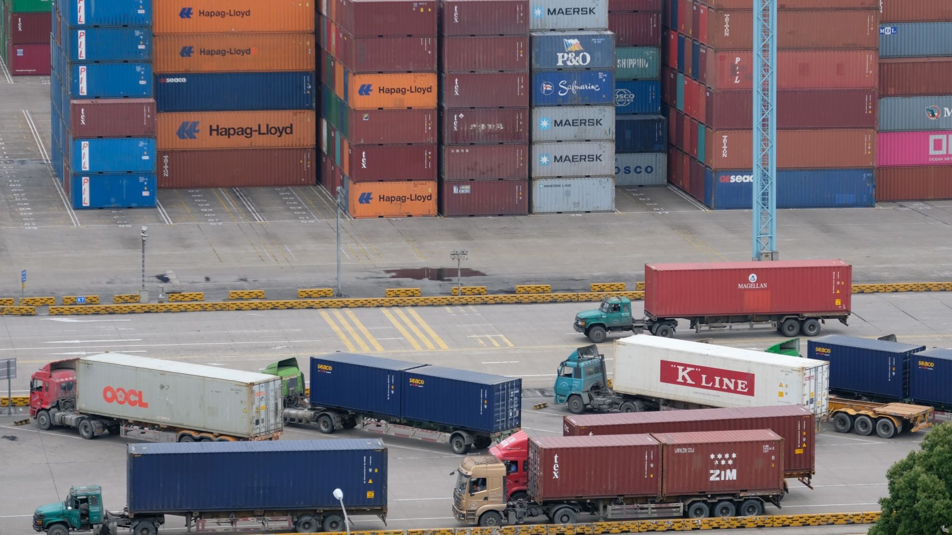 Trucks and containers at a Chinese port.