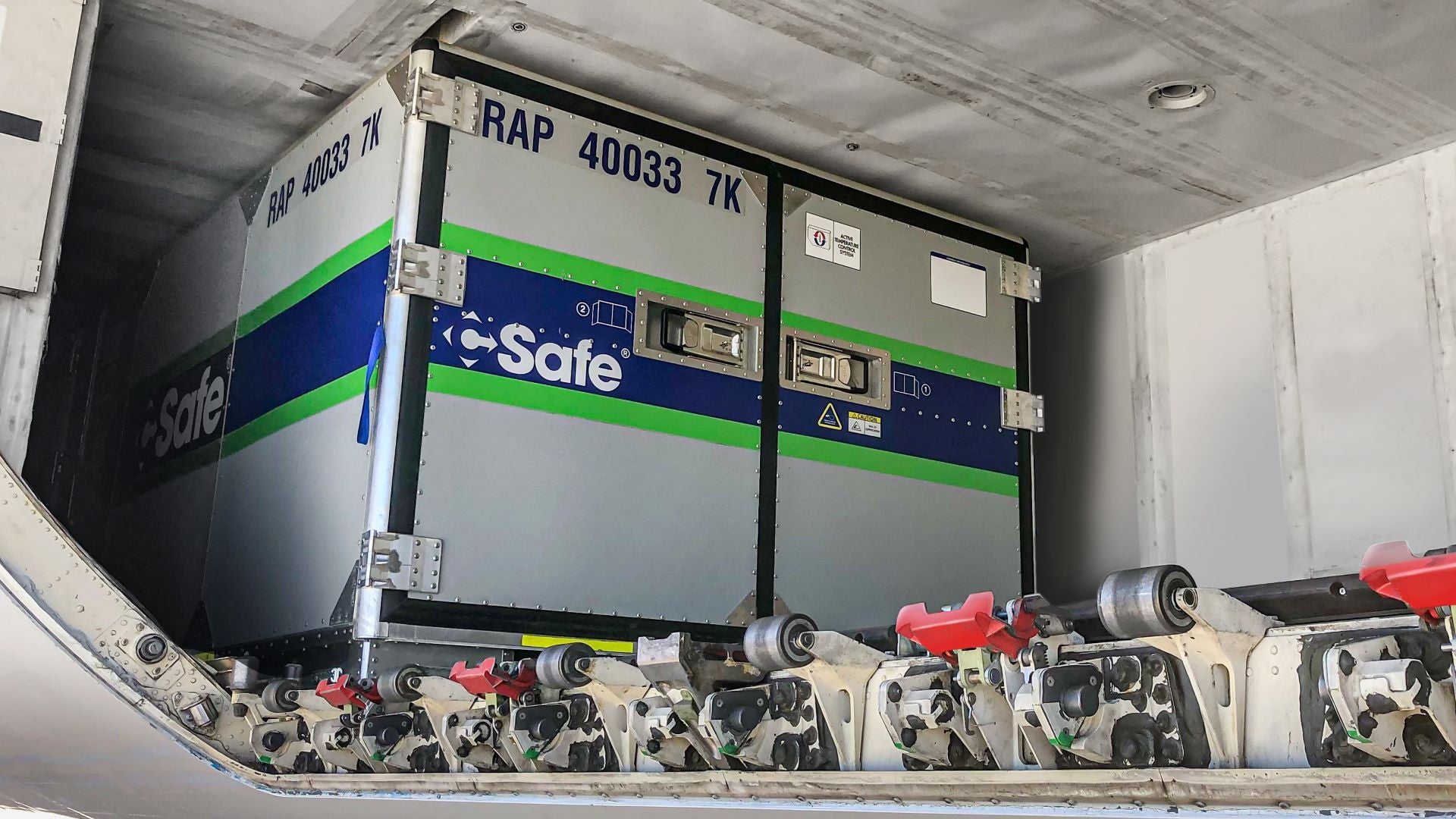 A cooling container in the lower hold of a passenger plane.