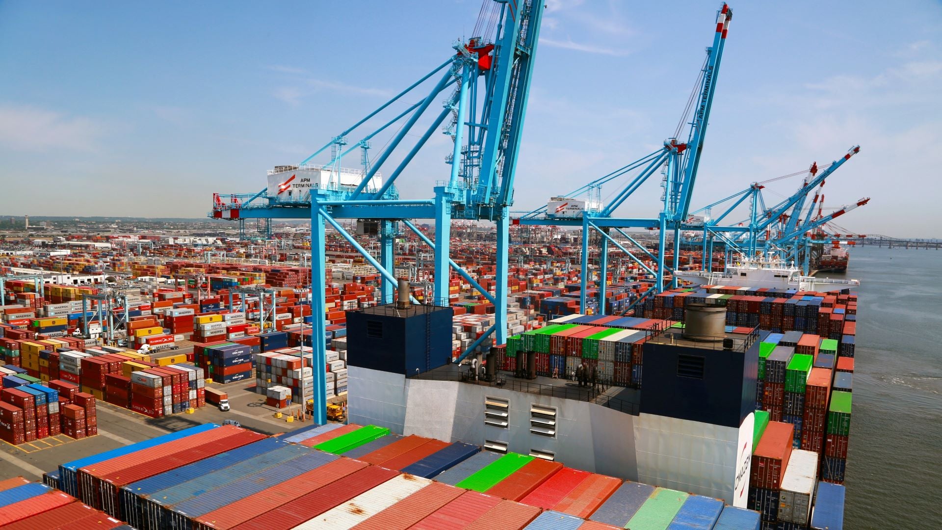 Cranes, vessel and containers at a port.