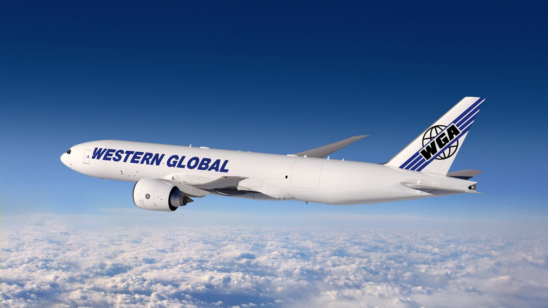 A white plane with blue Western Global lettering flies above white clouds.