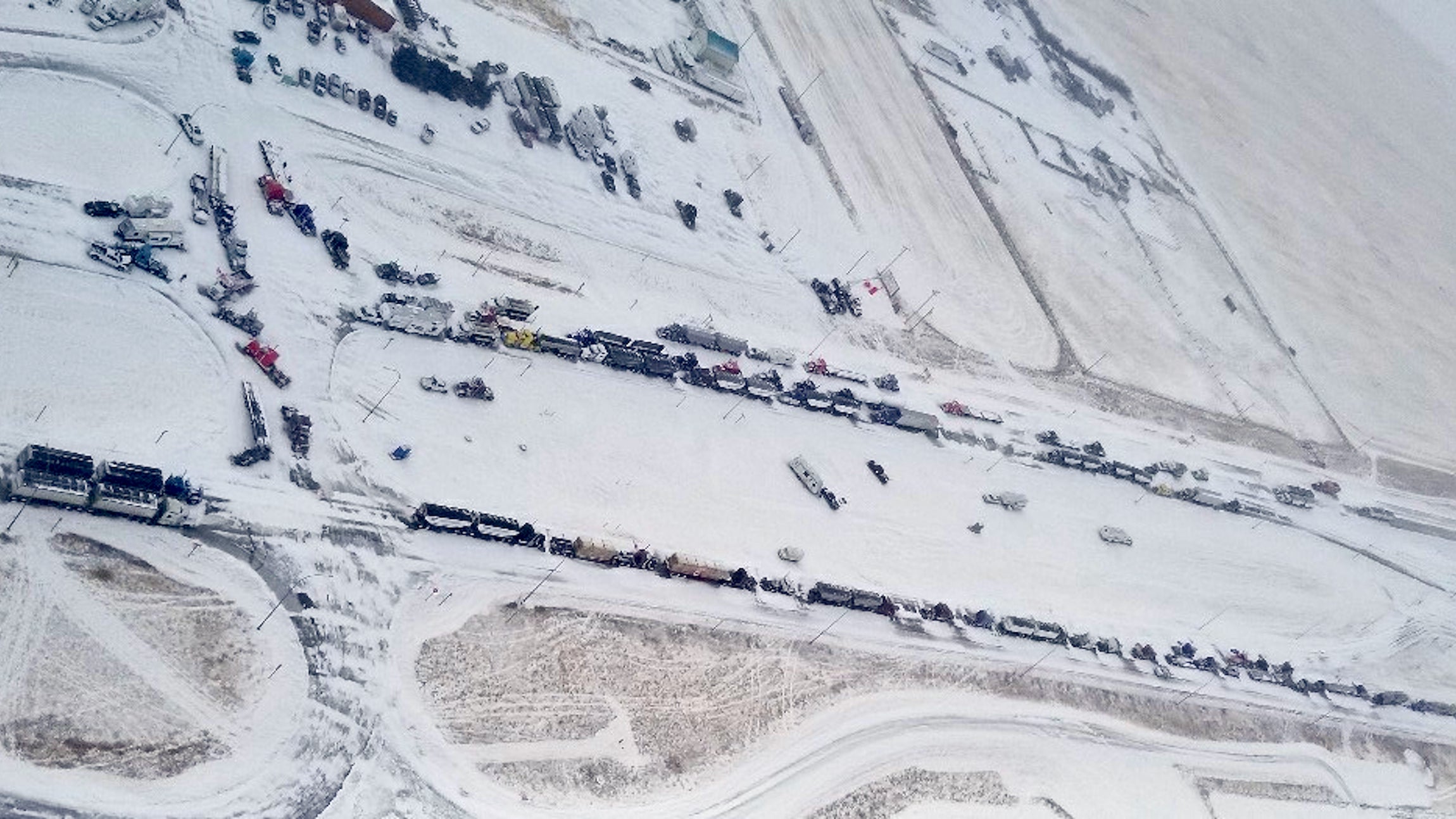 An aerial image showing trucks blocking the U.S.-Canada border in Coutts, Alberta