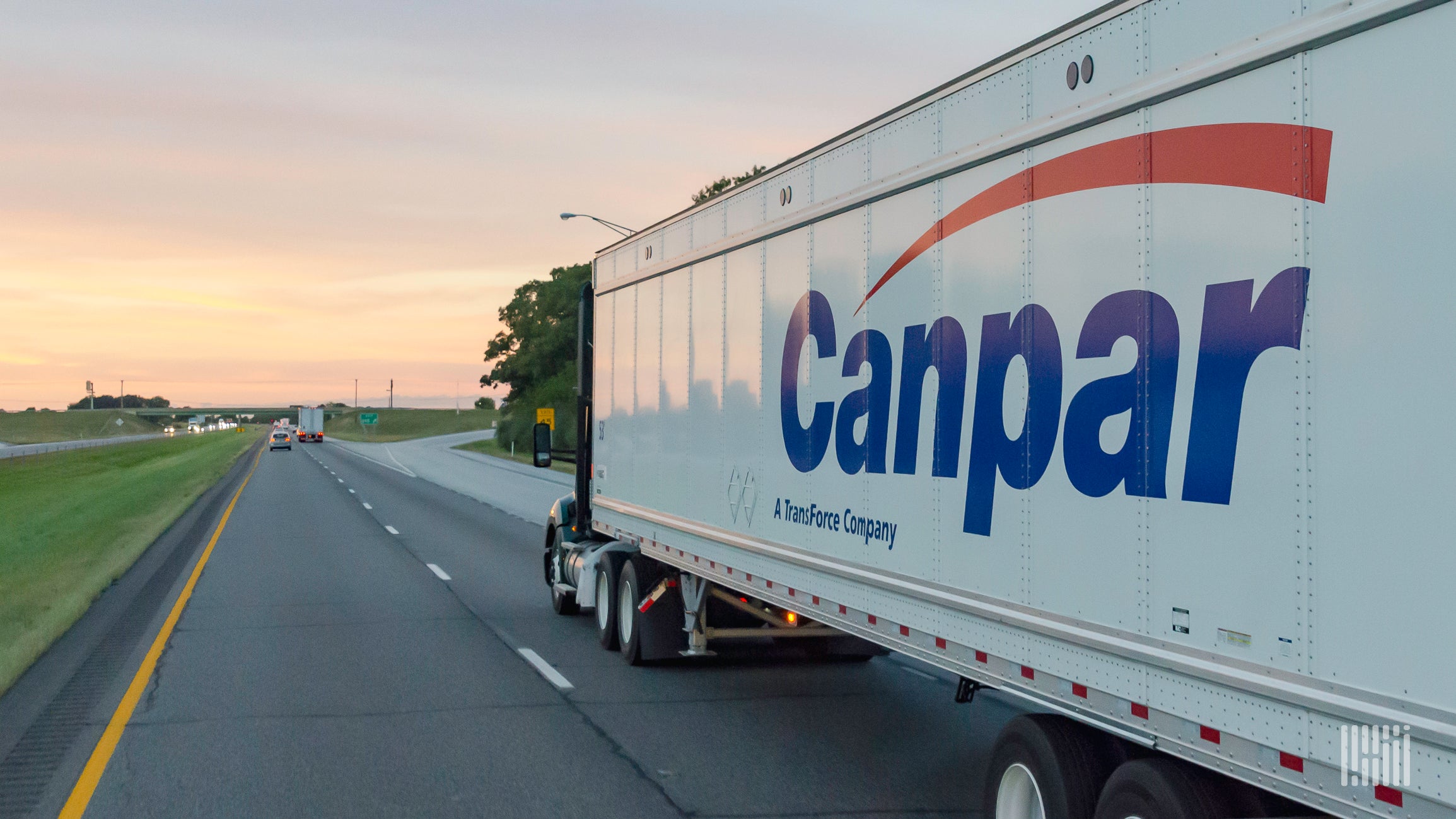 A truck pulling a trailer of Canadian trucking firm TFI International company Canpar in the United States.