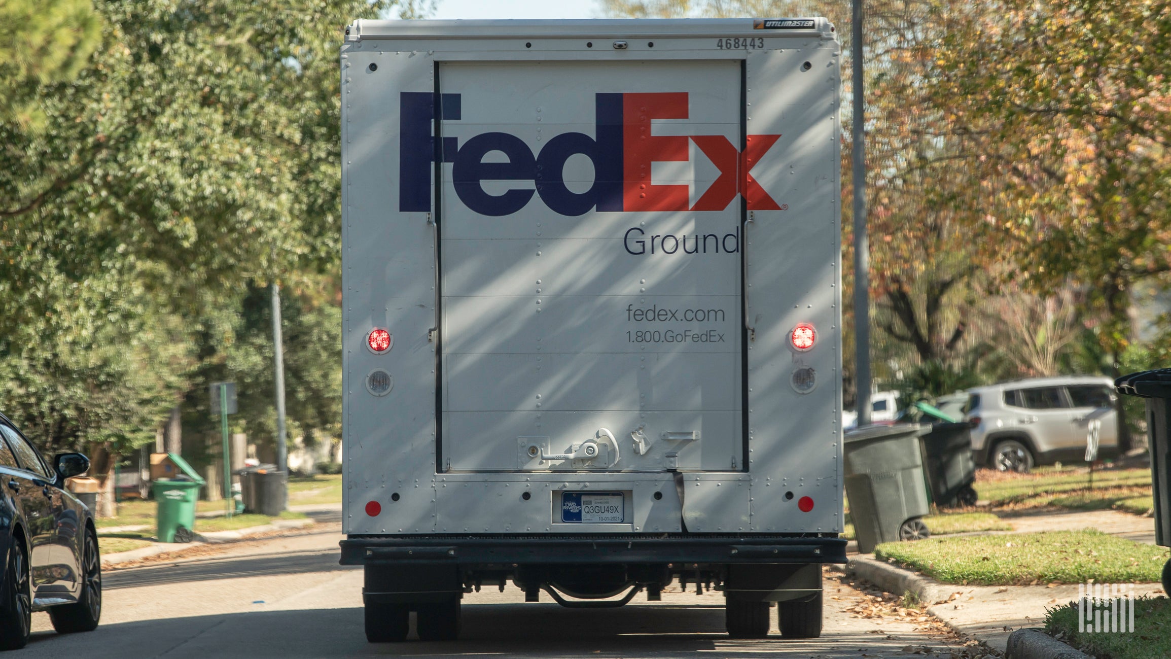 A white FedEx truck seen from behind.