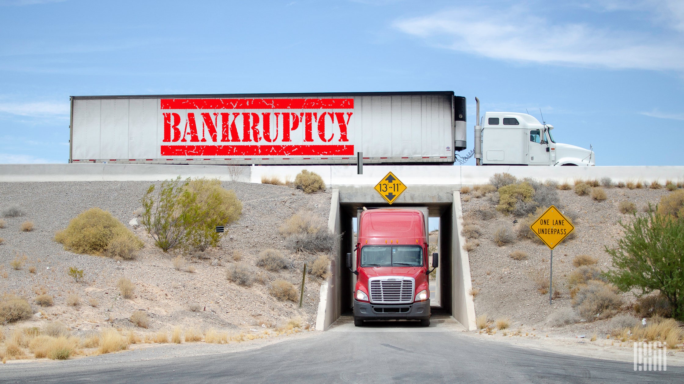 A white truck with the word bankrupt written on the trailer.