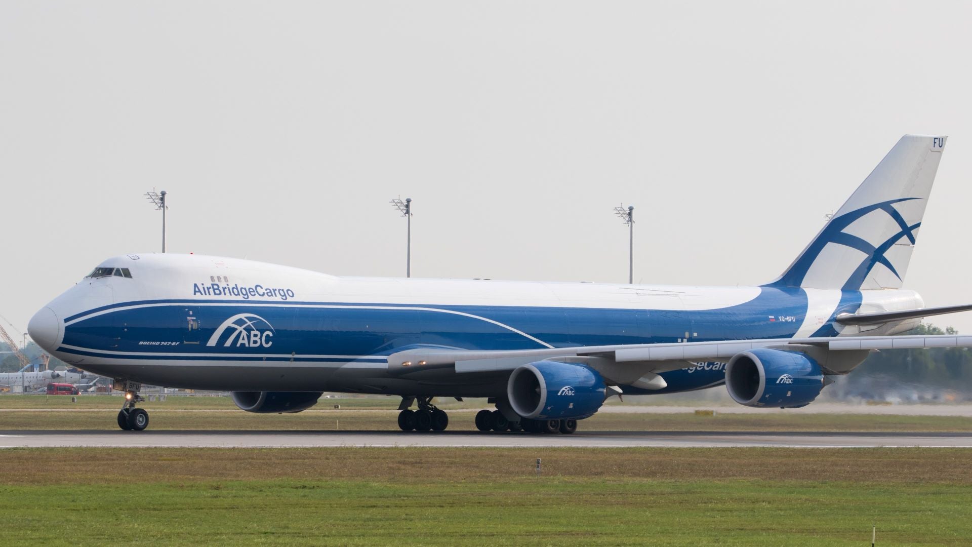 A blue-and-white Volga Dnepr jumbo jet on the tarmac.