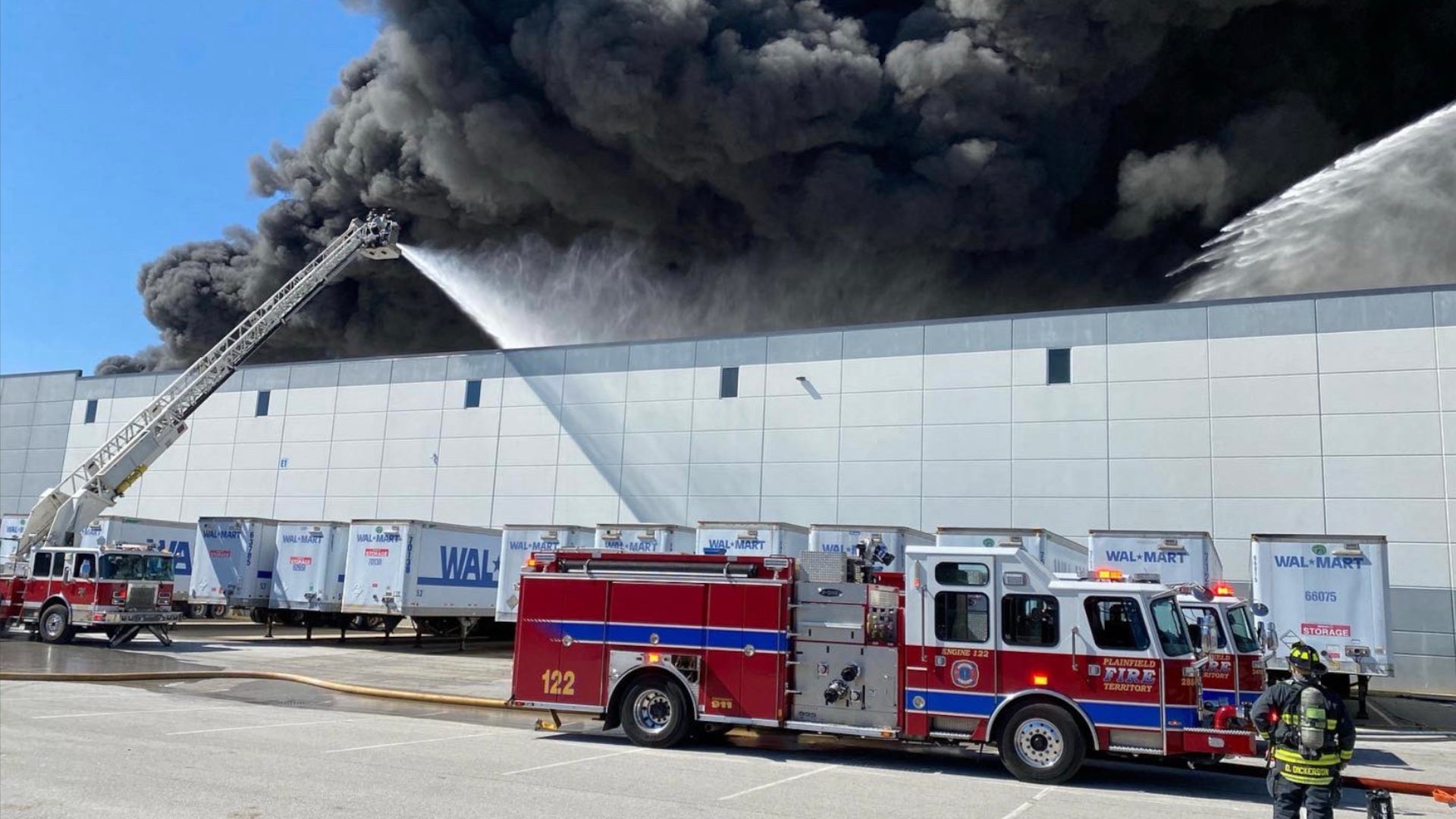 A blaze broke out at a Walmart distribution center near Indianapolis, burning into the evening