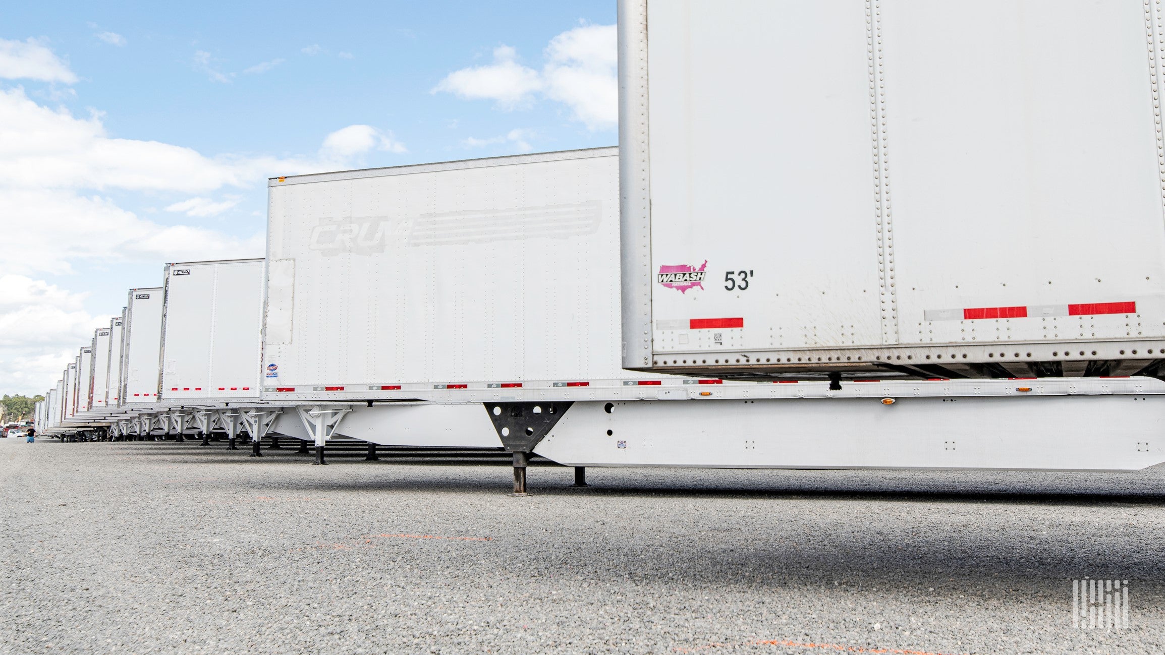 A row of white trailers at auction