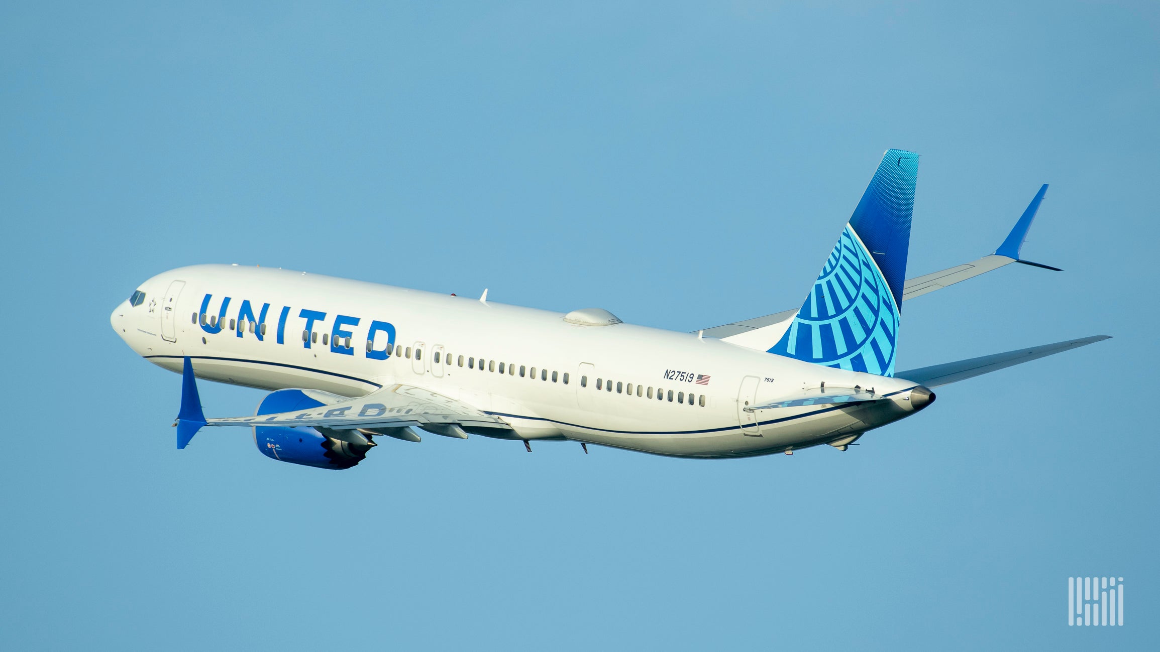 A white United Airlines jet with a blue tail flying into the blue sky heading away from the camera.