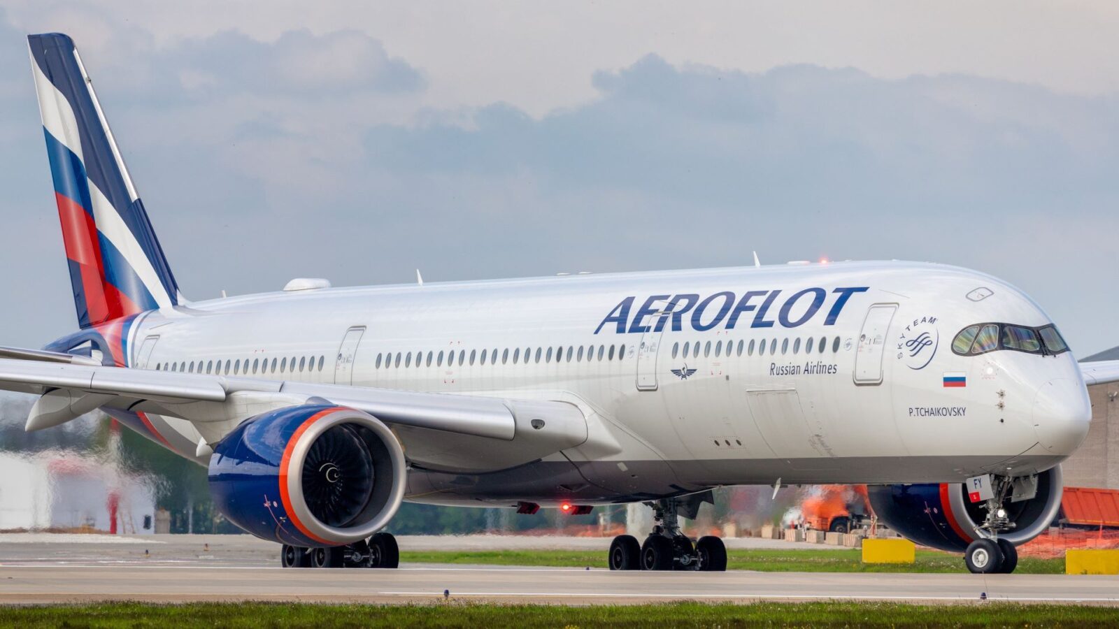 A large, white Aeroflot jet taxiing at an airport