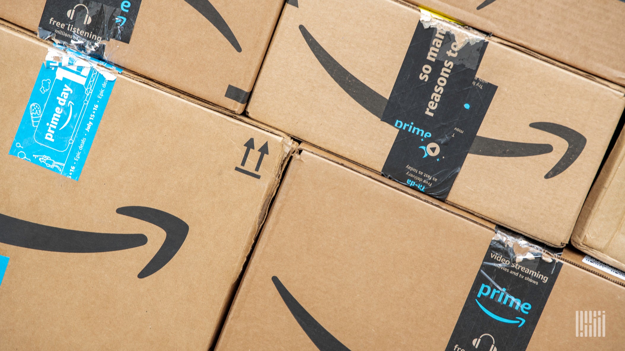 Amazon packages with Prime logo, focus on Prime as it expands its logistics network