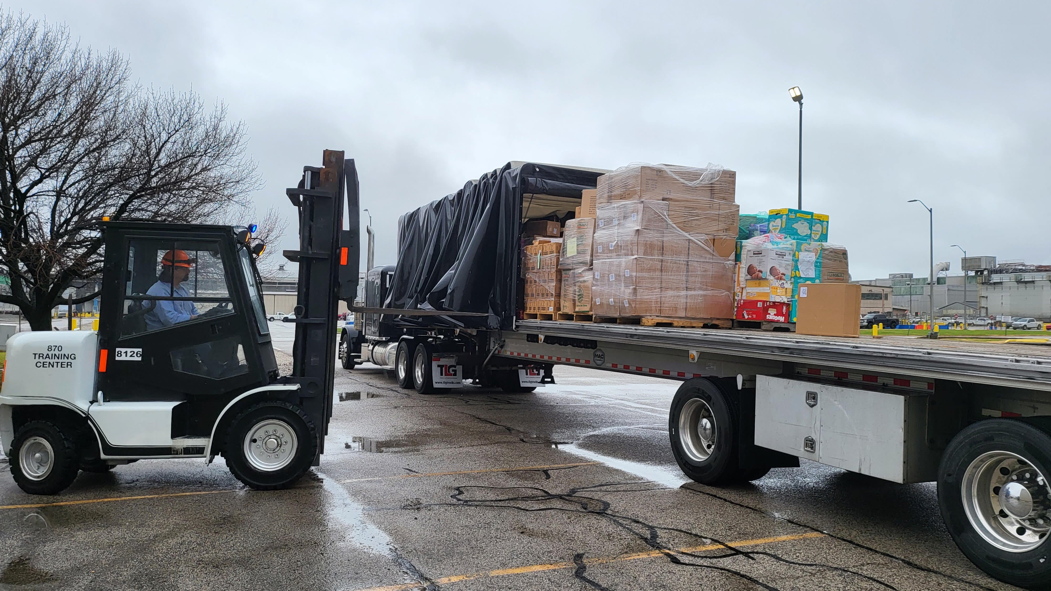 Flatbed trailer with load of disaster relief supplies.