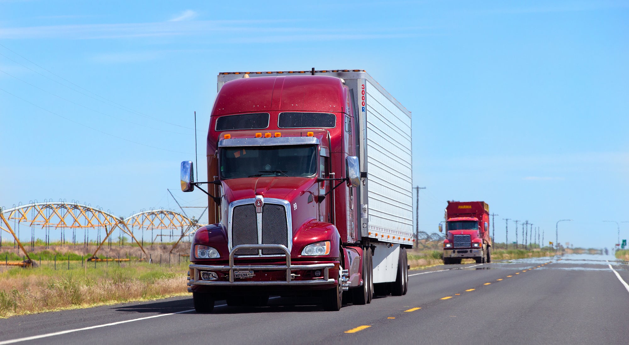 red and white truck on highway