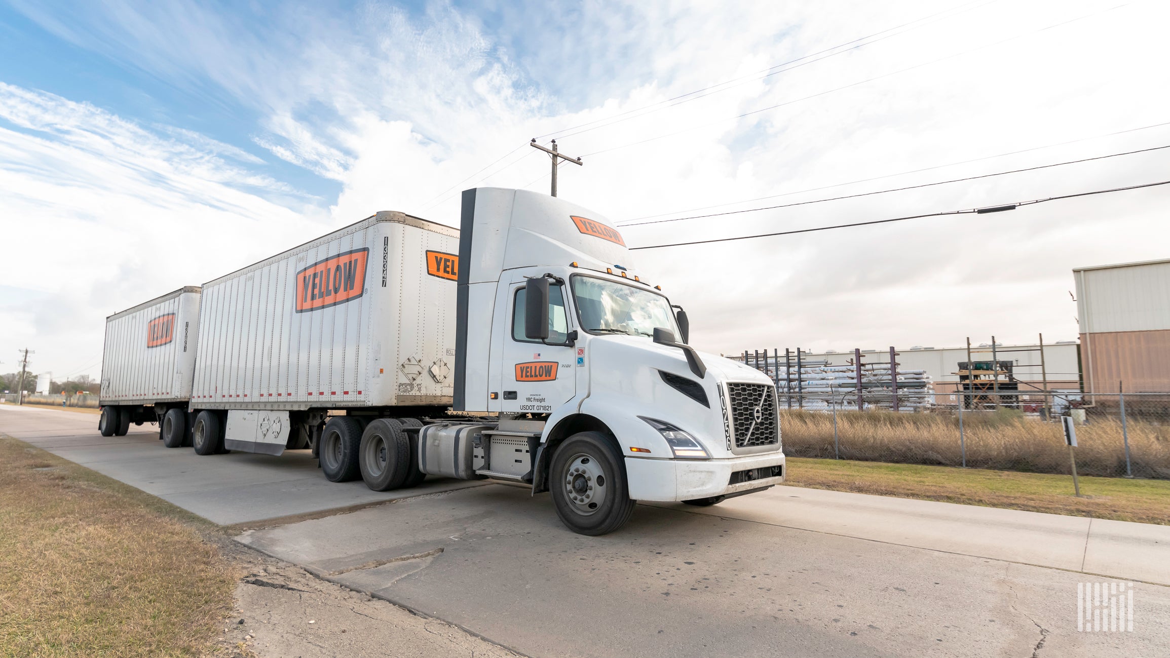 A tractor-trailer of LTL carrier Yellow Corp travels on a road.