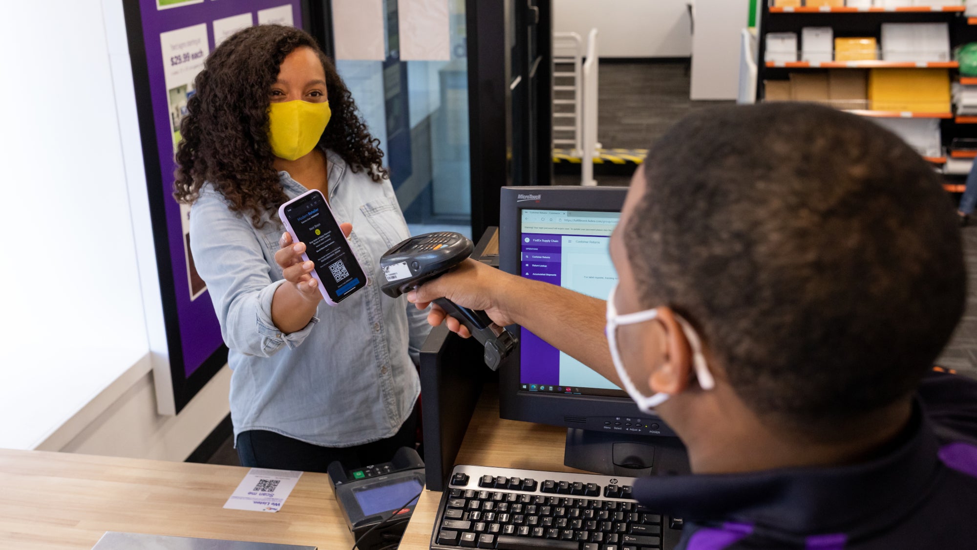 Woman scans QR code at sales counter