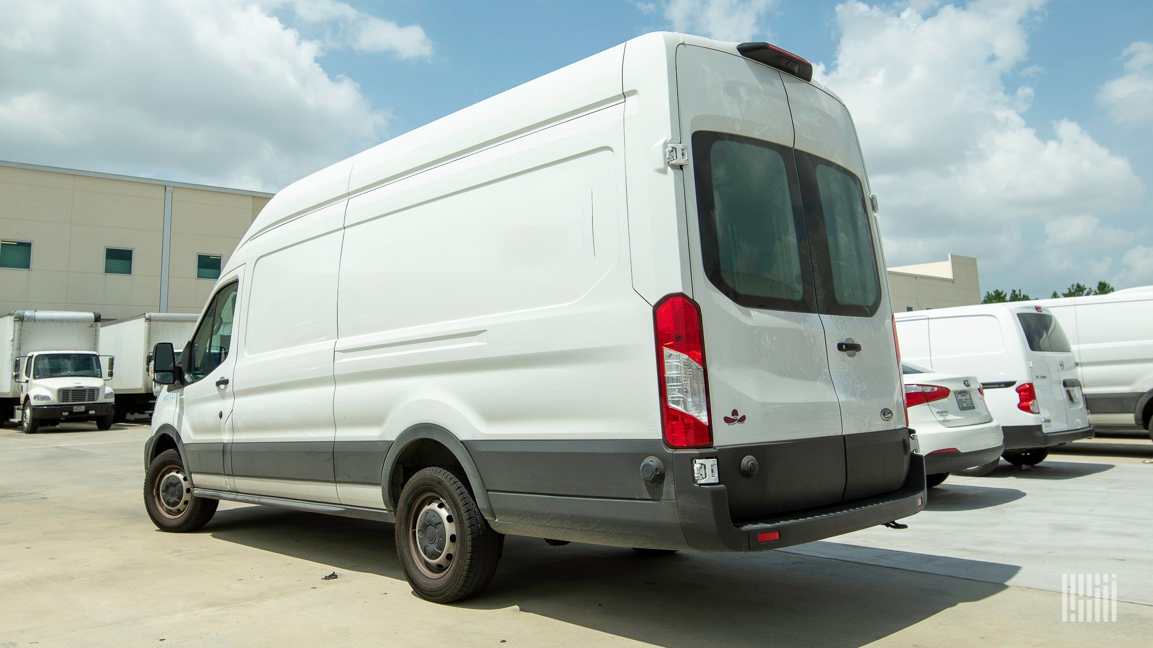 white van sitting in a parking lot