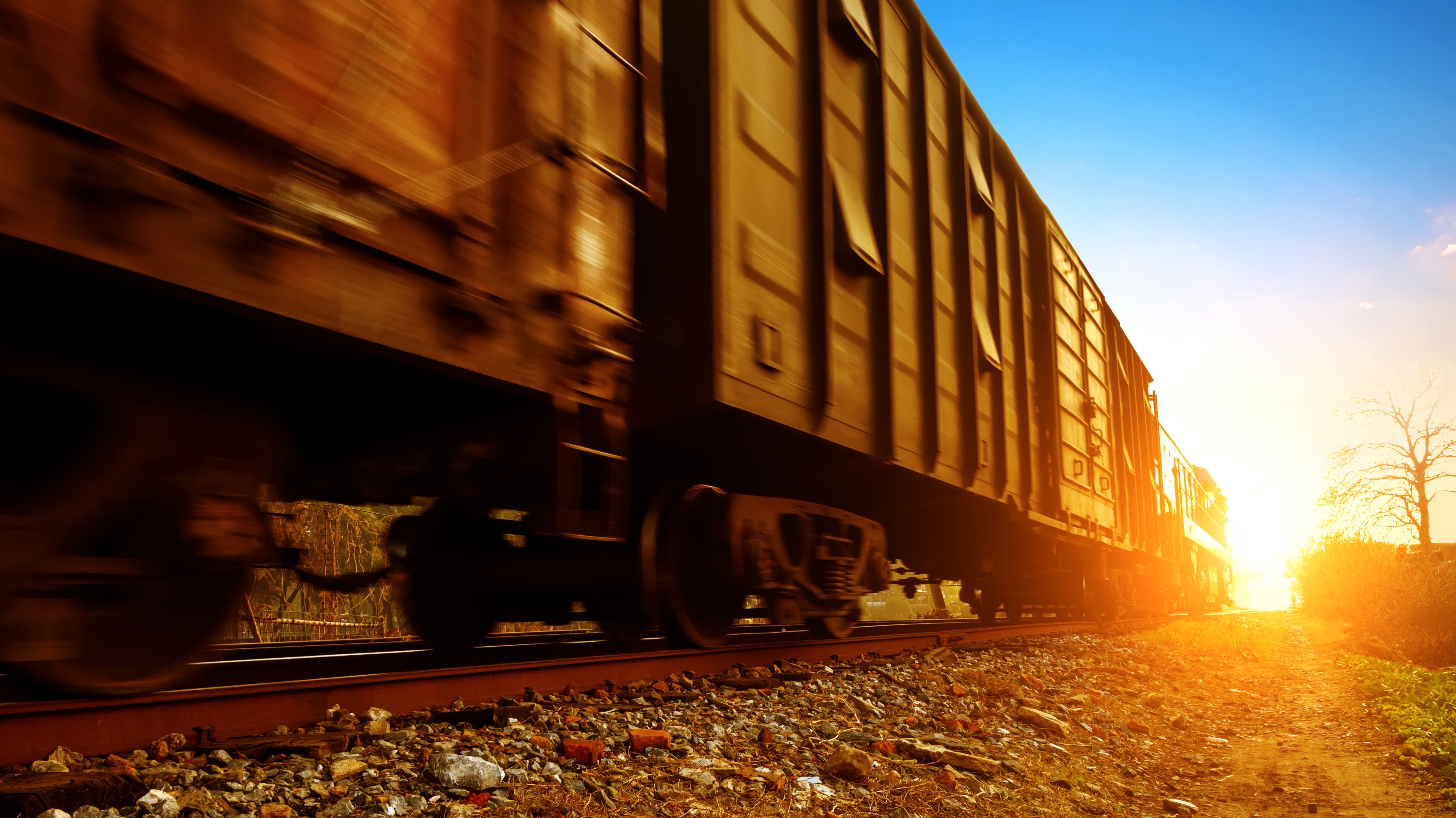 A train heads into the sunset.