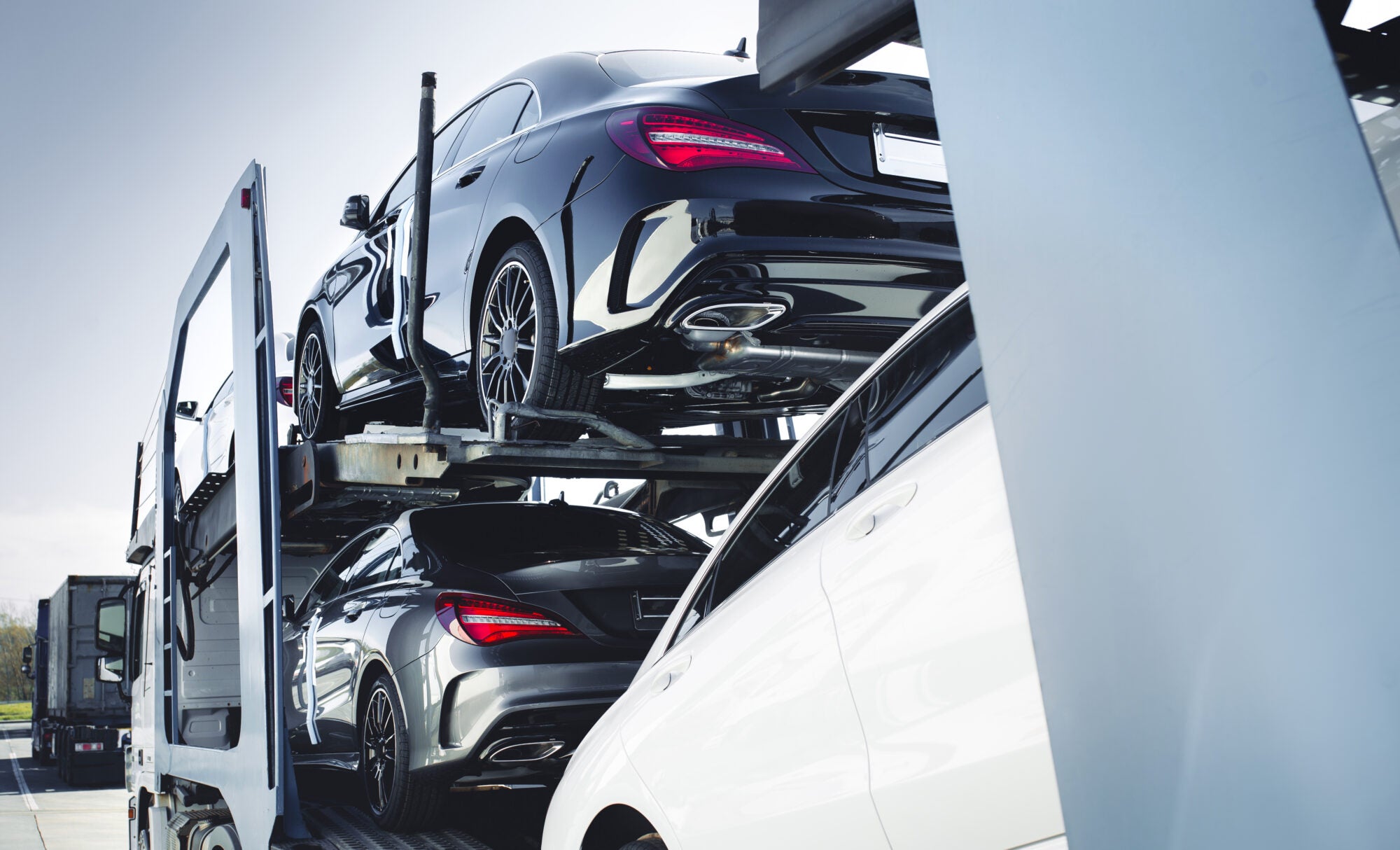 Cars loaded in the trailer of a car-hauler.