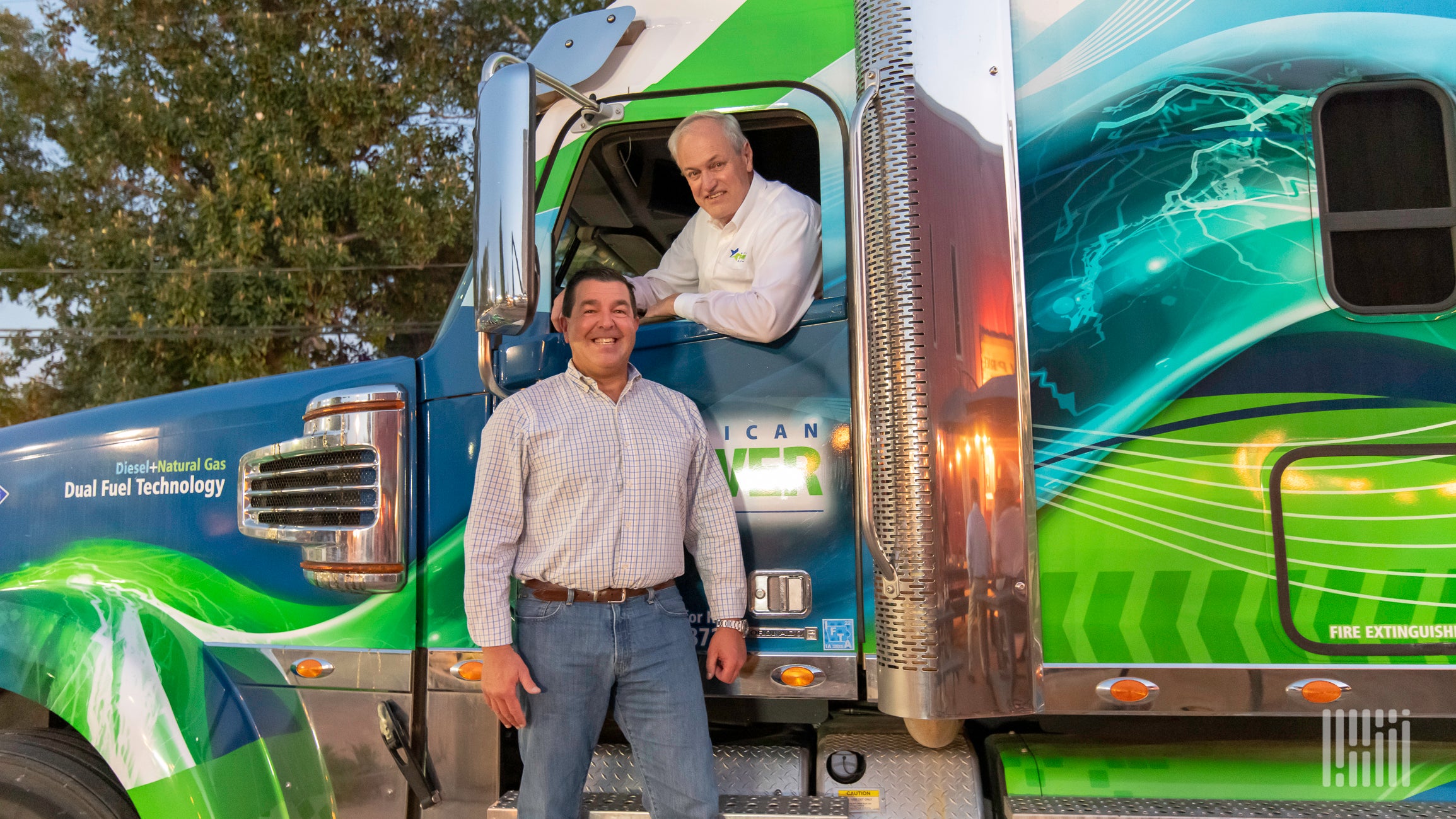 Chuck Coppa and Lyle Jensen with Freightliner Coronado retrofit to run and natural gas and diesel fuel