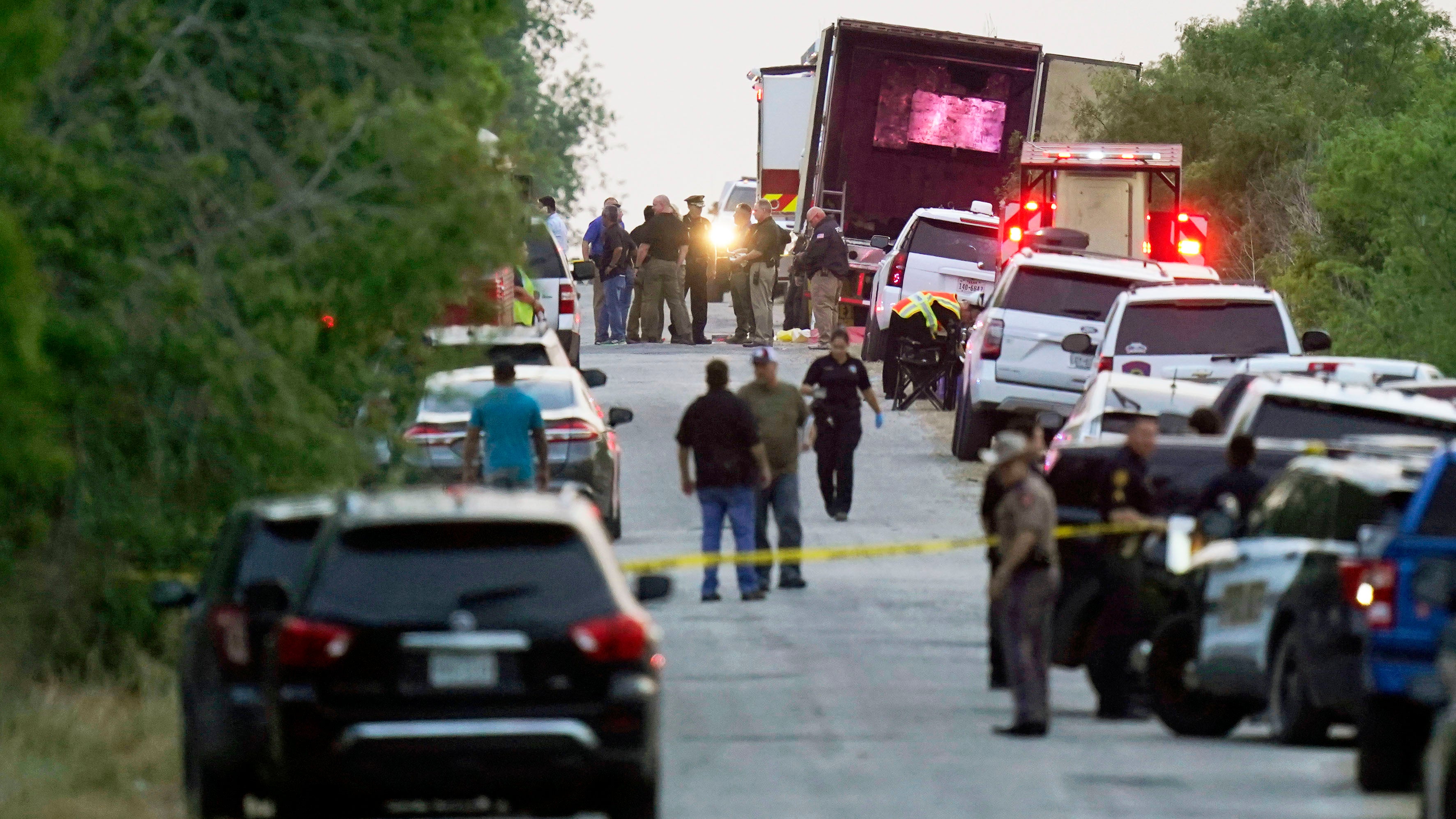 Police and other first responders work the scene dozens of people were been found dead in a trailer in San Antonio