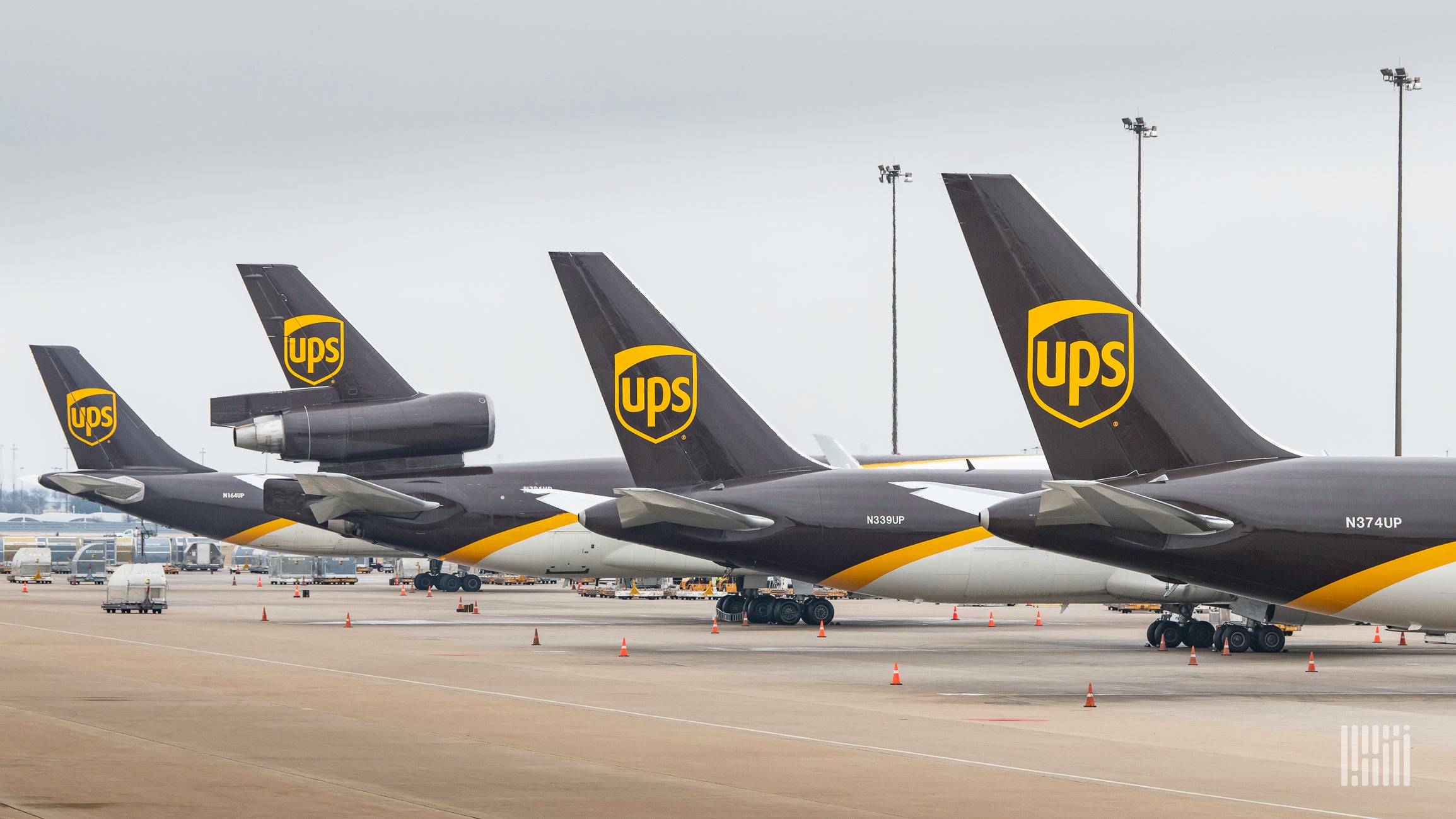 UPS "brown tails" lined up at an airport.