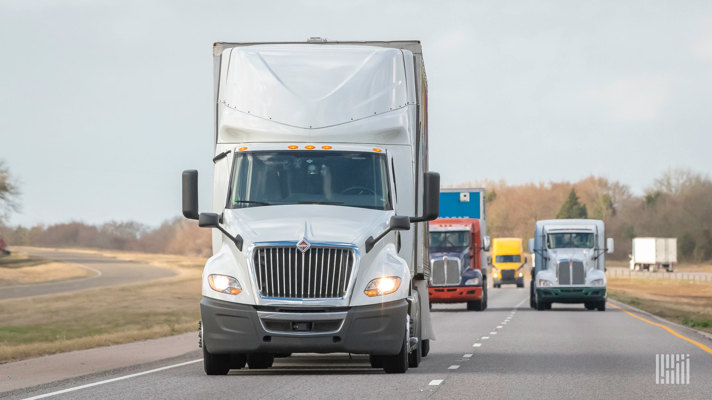 Several trucks on a highway