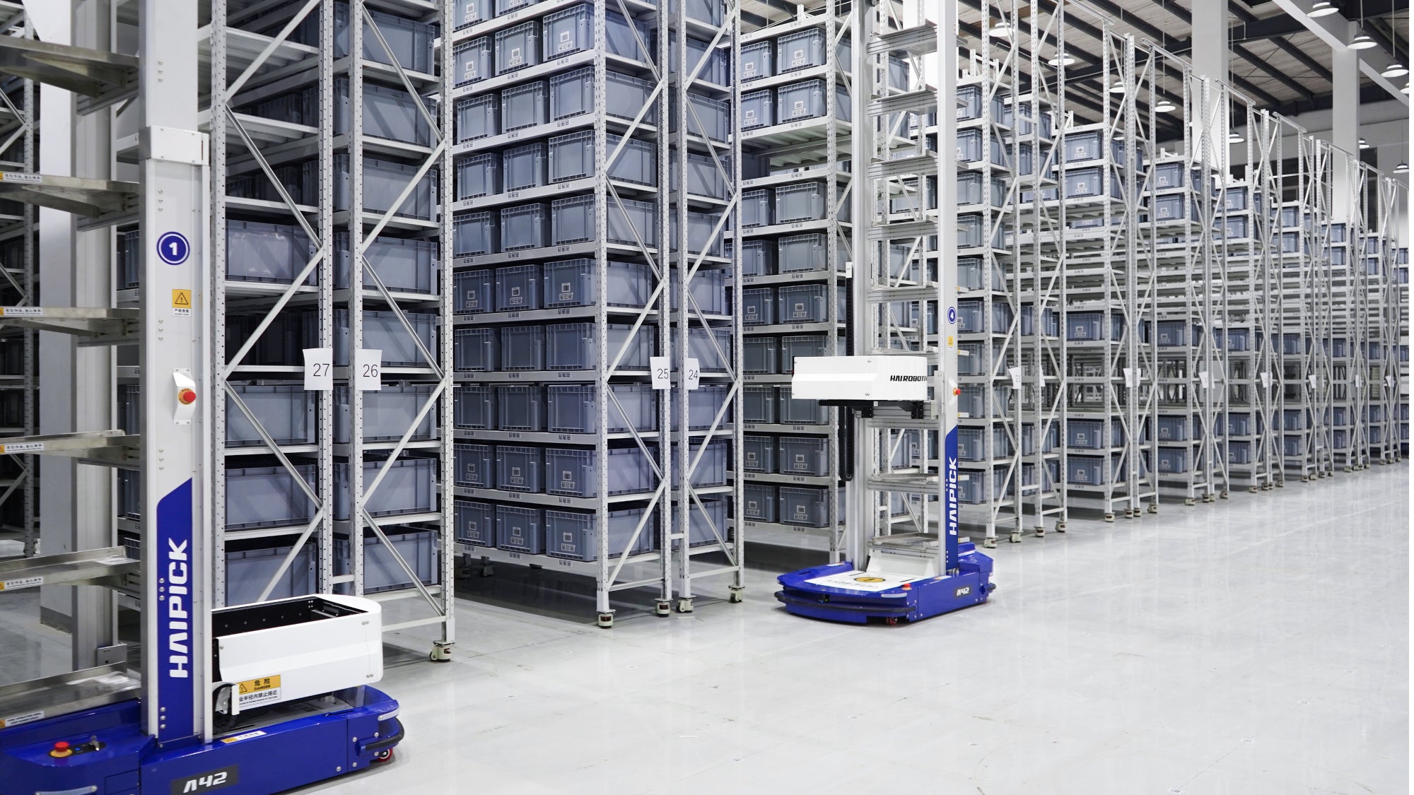 robots near warehouse shelving