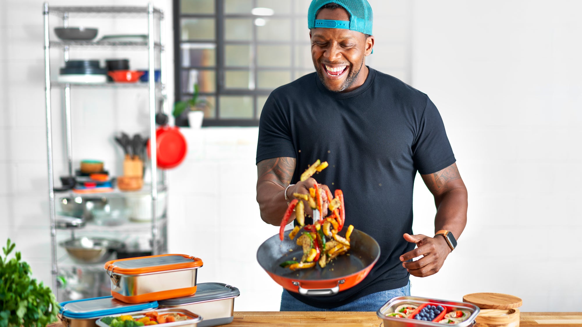 Man cooking food in a frying pan