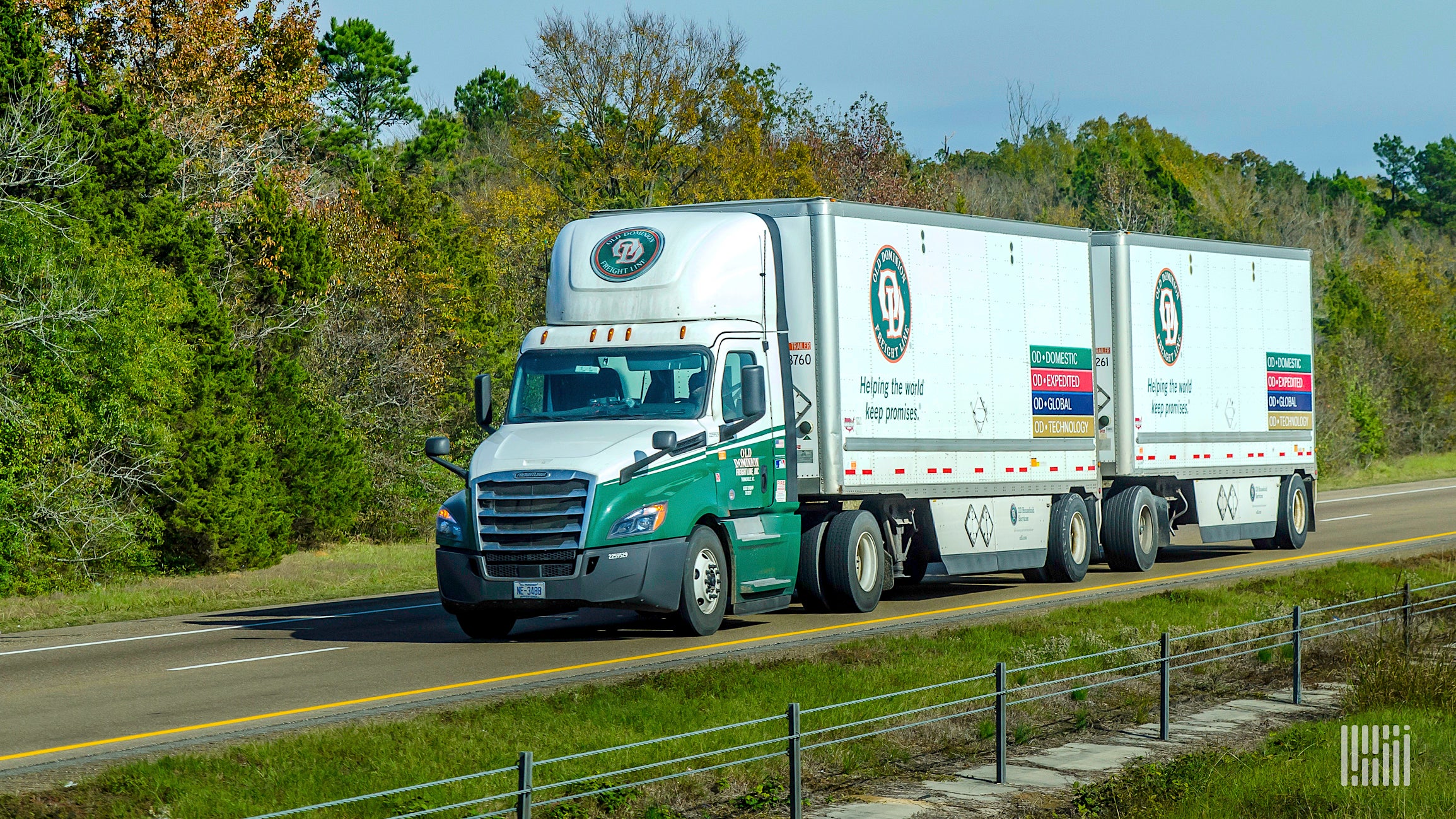 An Old Dominion truck pulling a double trailer.