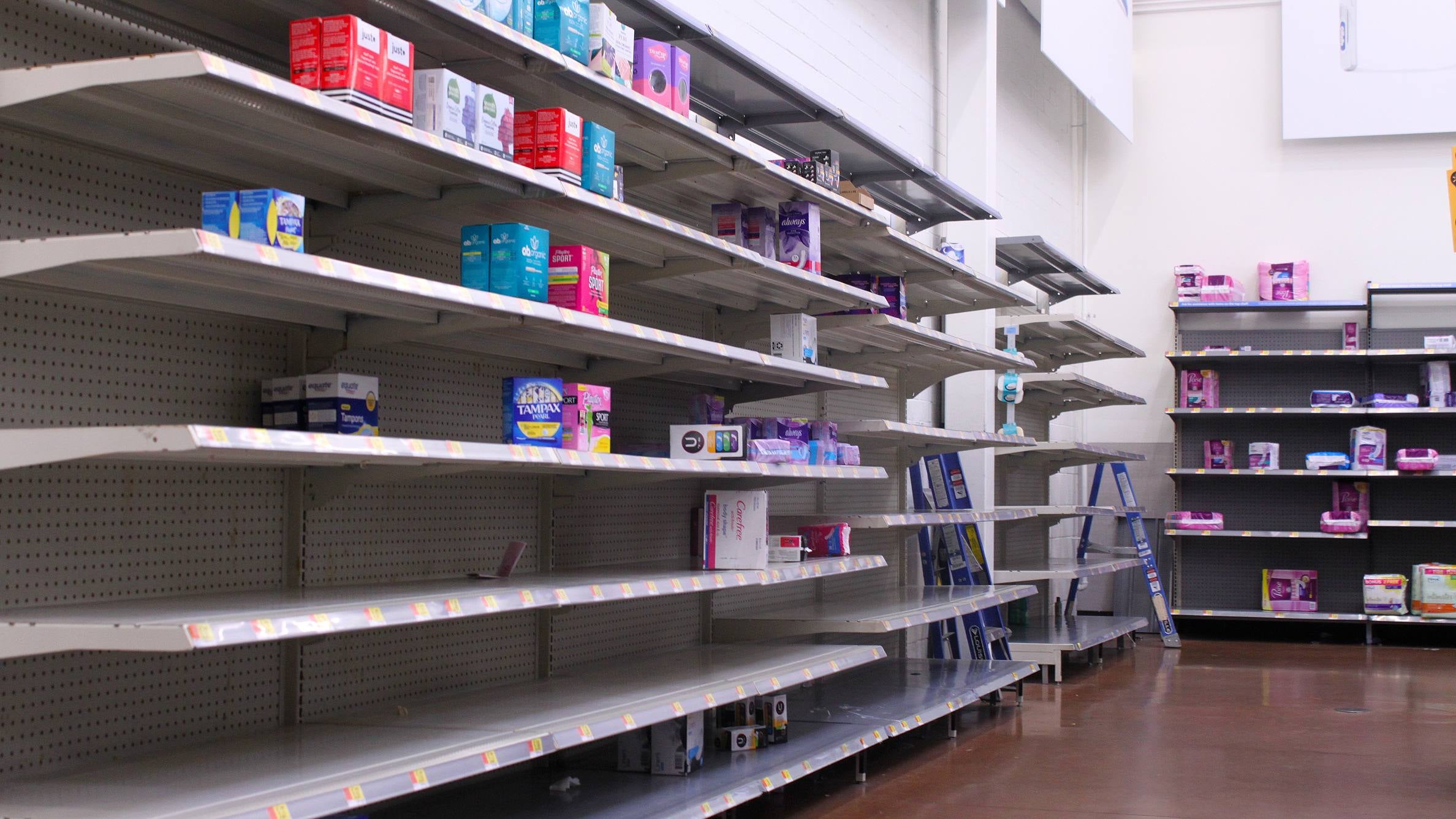 Nearly empty store shelves show tampons are in short supply.