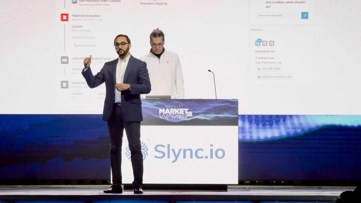 Slync.io co-founder Raj Patel demonstrating the company's products at a conference.