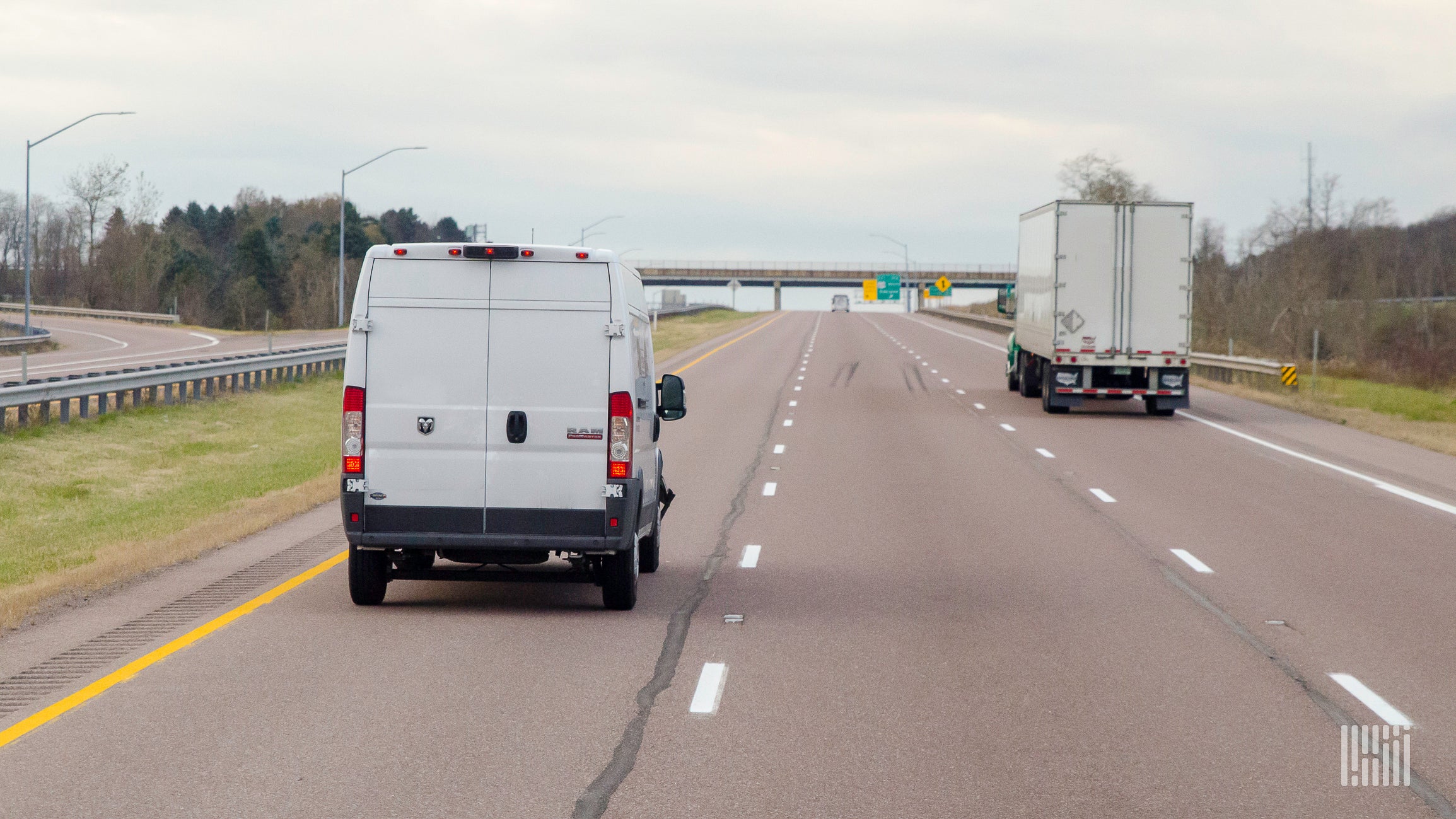 white delivery van on the highway